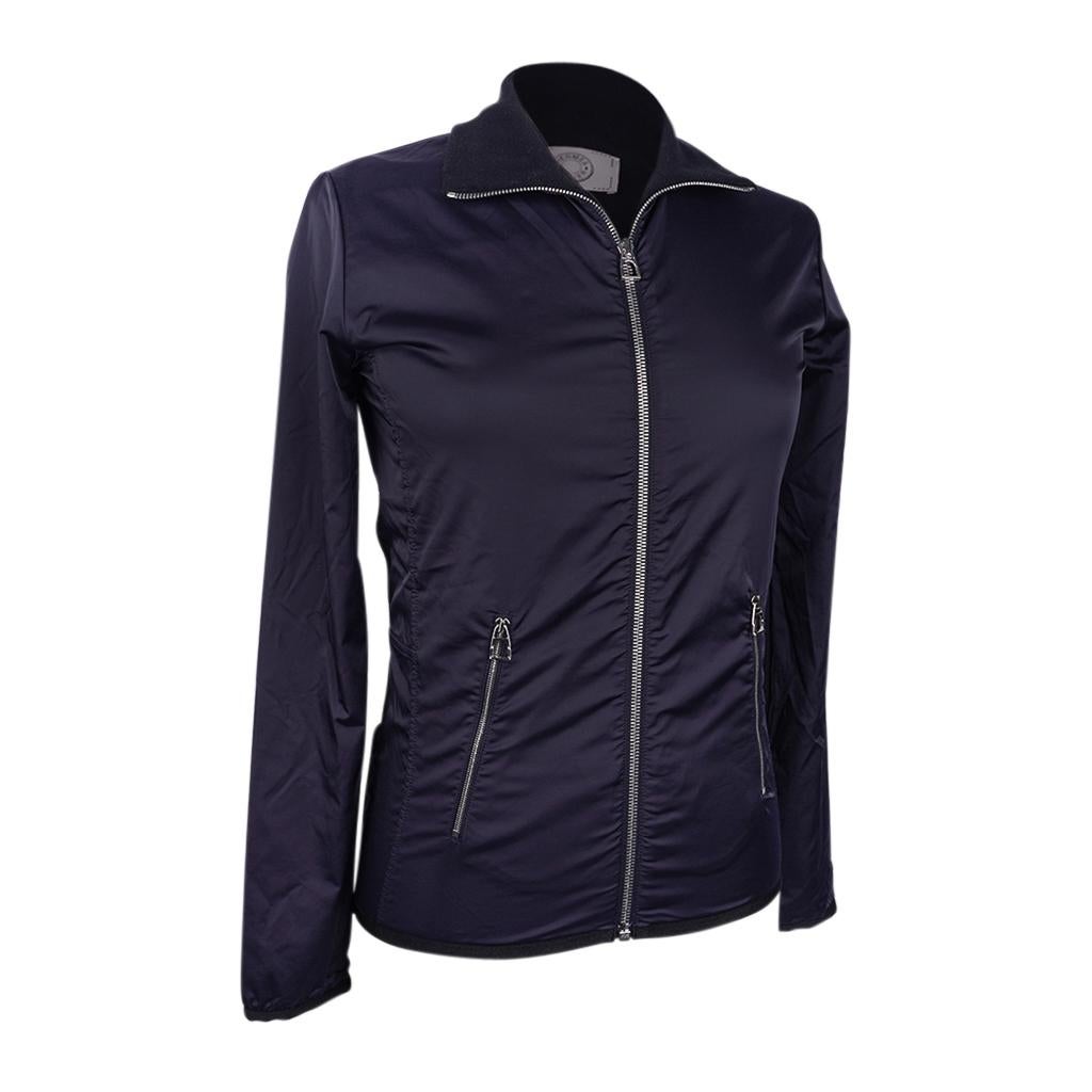 Mightychic offers an Hermes Warm-Up Fleece featured in Navy.
Fleece jacket has water resistant, breathable fabric.
Light, but warm.
High collar and slim cut.
Front zip with and side zips pockets have the iconic embossed stirrup pull.
Fabriquées en