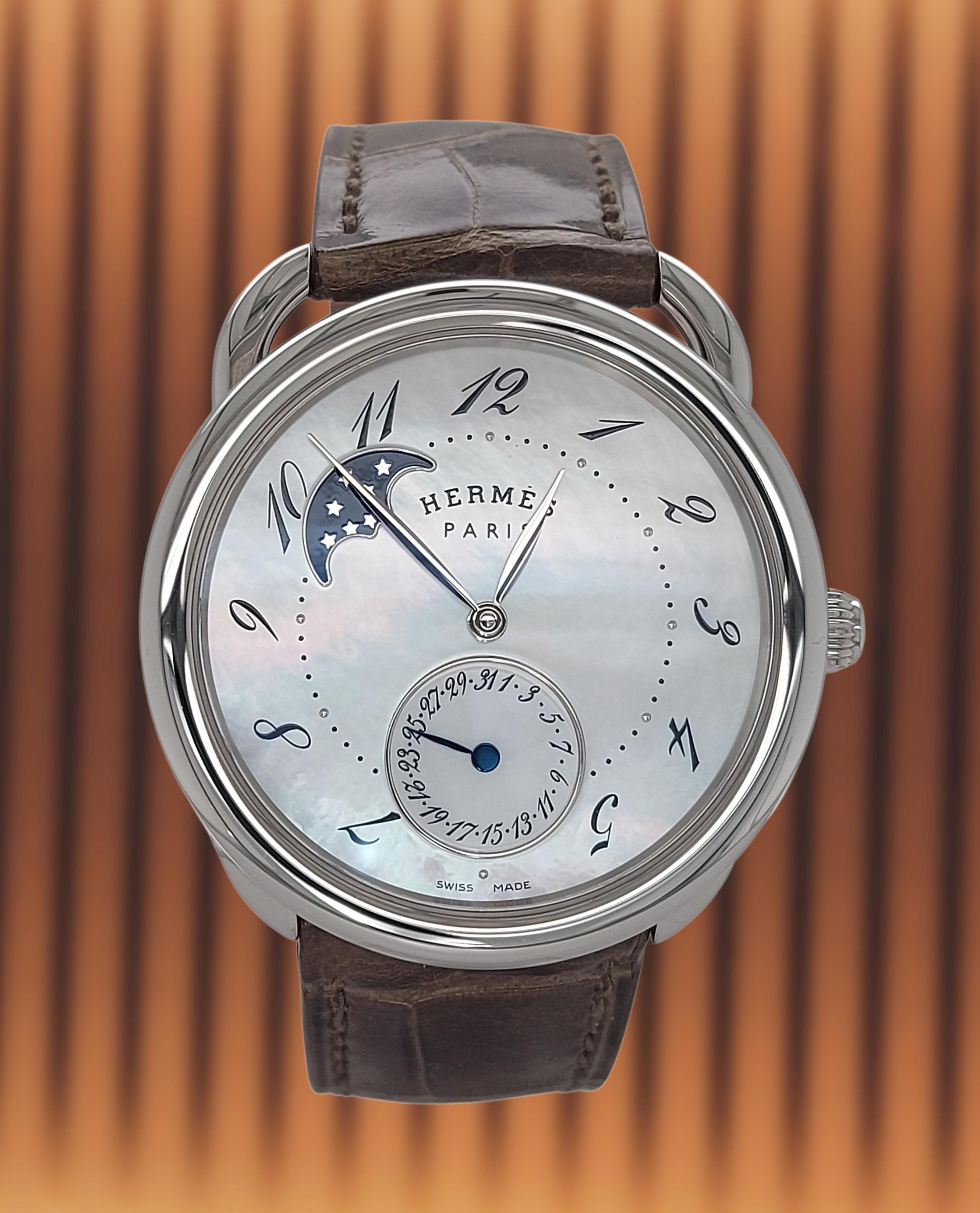 HERMES  Arceau Petite Lune Moon phase Watch,Mother of Pearl Dial 
Movement : Mechanical Automatic Selfwinding
Stainless steel Case and Hermes folding buckle.38mm
Dial : Mother of Pearl 
Reference : w041045WW00
Strap : Hermes Crocodile

Designed by