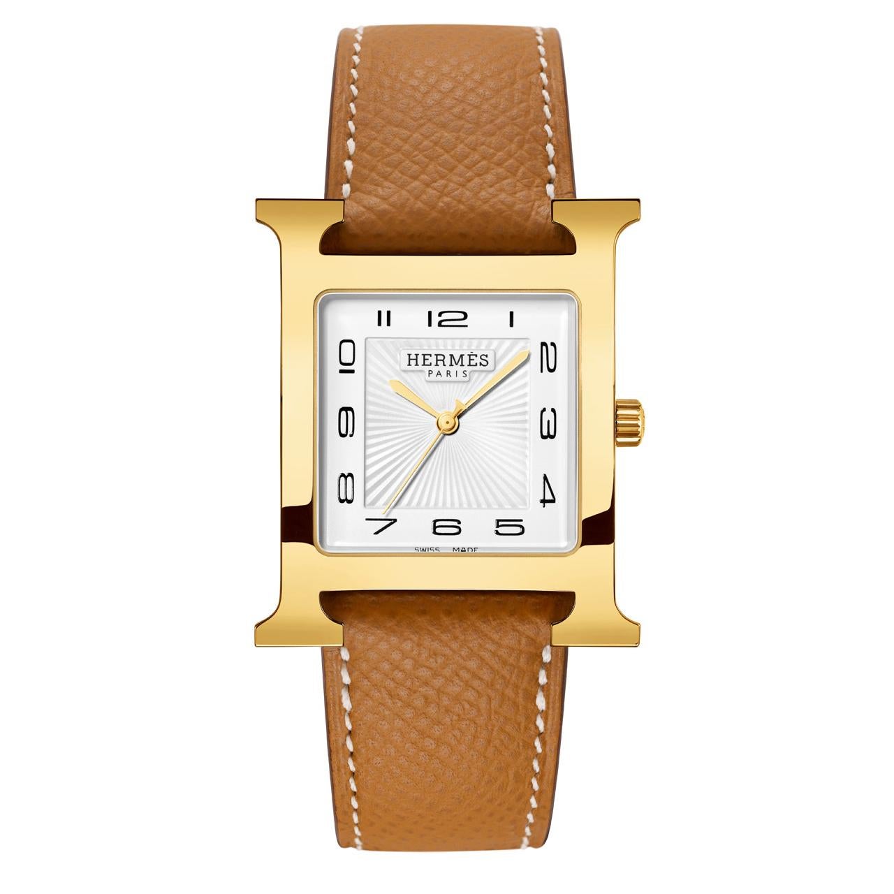 Yellow-gold plated steel watch with sunburst stamped motif, white dial. Quartz movement. Strap in gold Epsom calfskin. Box and papers.