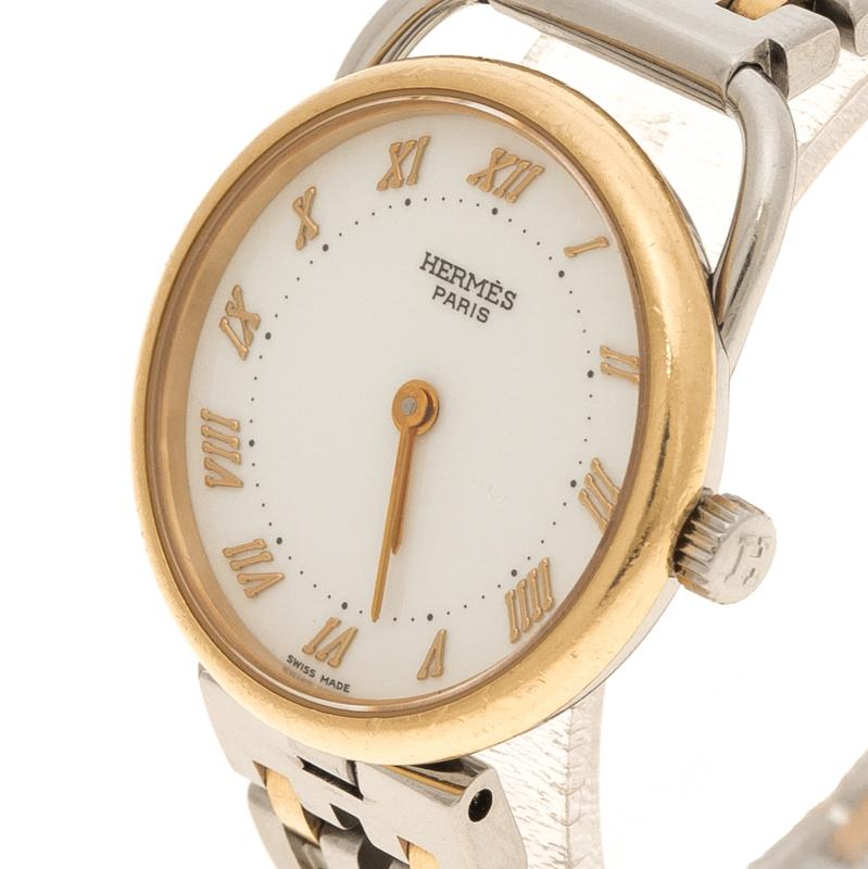 Hermes’ Arceau is a must-have watch in your coveted watch collection. The stainless steel case is equipped with an 18K yellow gold plated bezel encasing a spectacular white dial. The dial is accented with gold-tone Roman numeral hour markers and