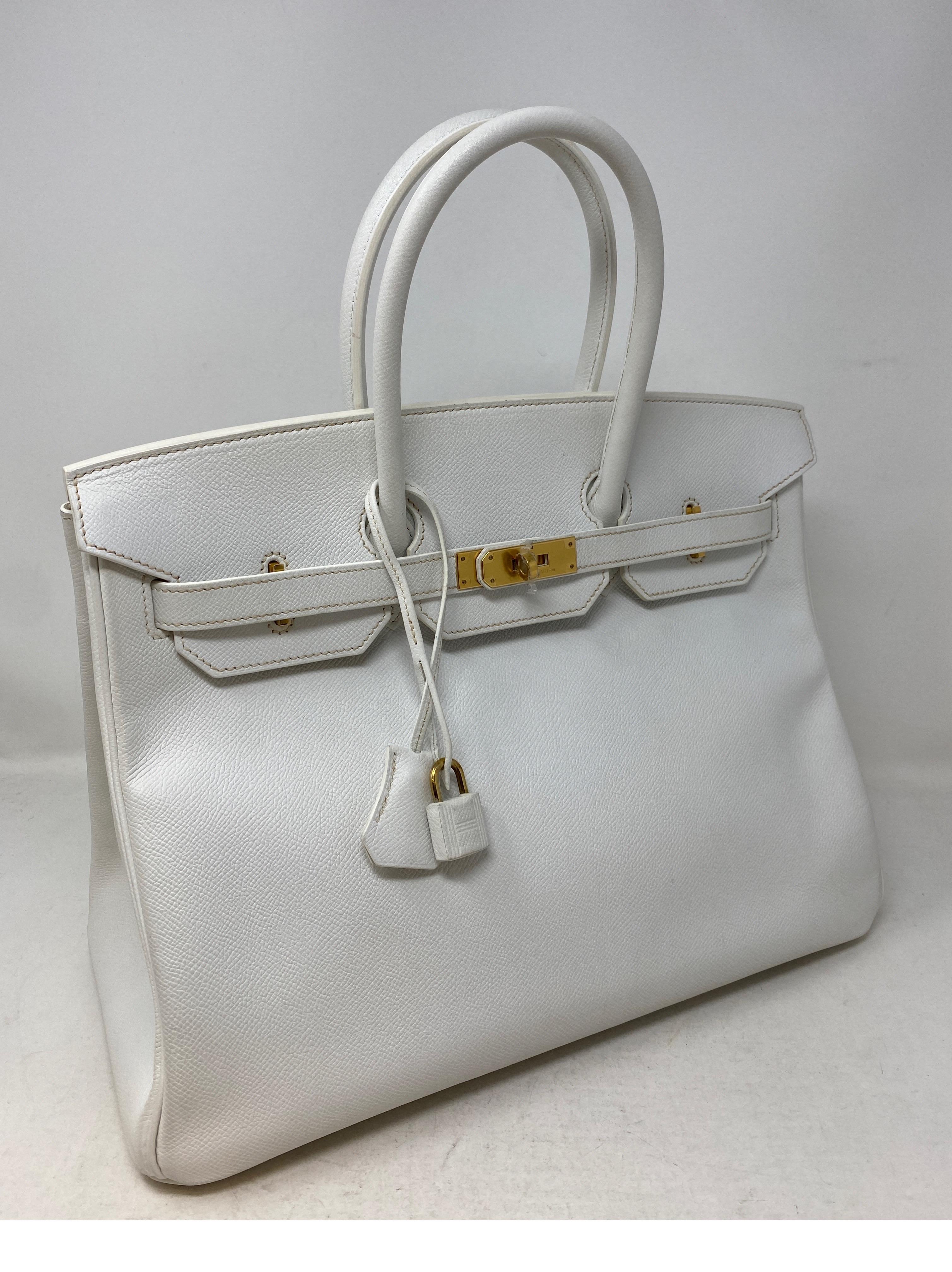 Hermes White Birkin 35 Bag. Rare white Birkin with gold hardware. Sought after white in good condition. Plastic still on hardware. Includes clochette, lock, keys, and dust cover. Guaranteed authentic. 