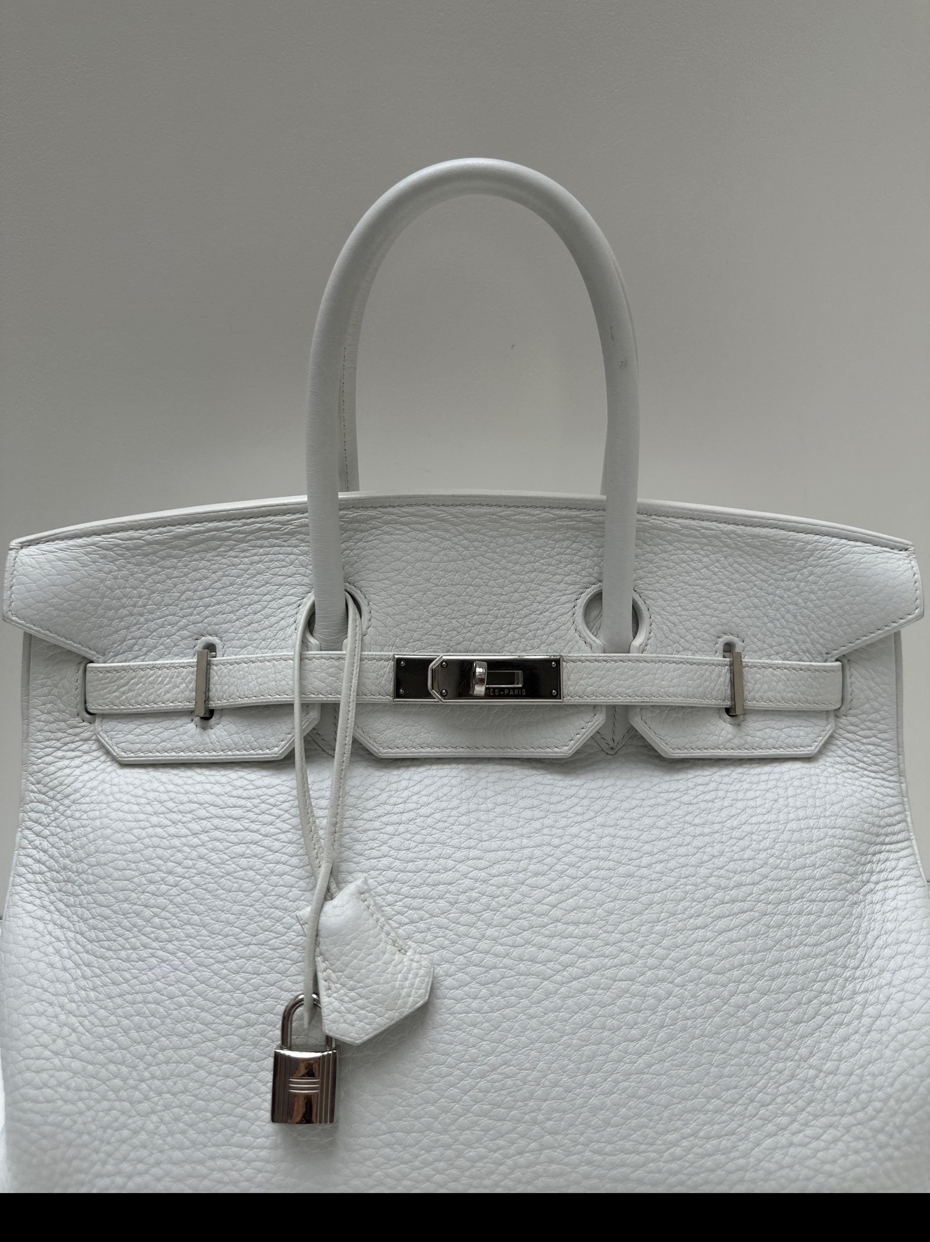 Hermes White Birkin 35 Bag. Excellent condition. Rare white color. Palladium silver hardware. Interior clean. Includes clochette, lock, keys, and dust bag. Great investment bag. Guaranteed authentic. 