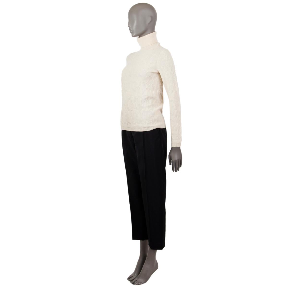 Hermès light knit turtleneck in cream cashmere (100%) with a strap-pattern, straight fit, ribbed cuff and hem. Unlined. Has been worn and is in excellent condition. 

Tag Size 34
Size XXS
Shoulder Width 35cm (13.7in)
Bust From 82cm (32in)
Waist From