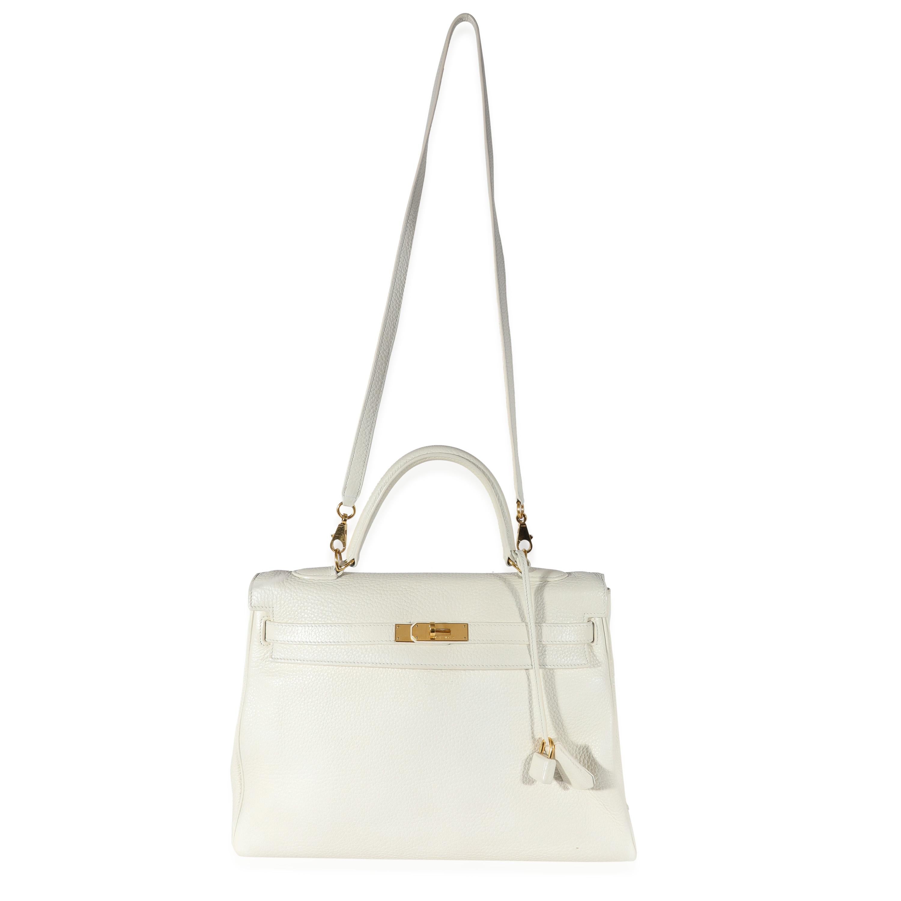 Listing Title: Hermès White Clémence Retourne Kelly 35 GHW
SKU: 122229
Condition: Pre-owned 
Handbag Condition: Very Good
Condition Comments: Very Good Condition. Scuffing at corners and throughout. Scratching and tarnishing at hardware. Light