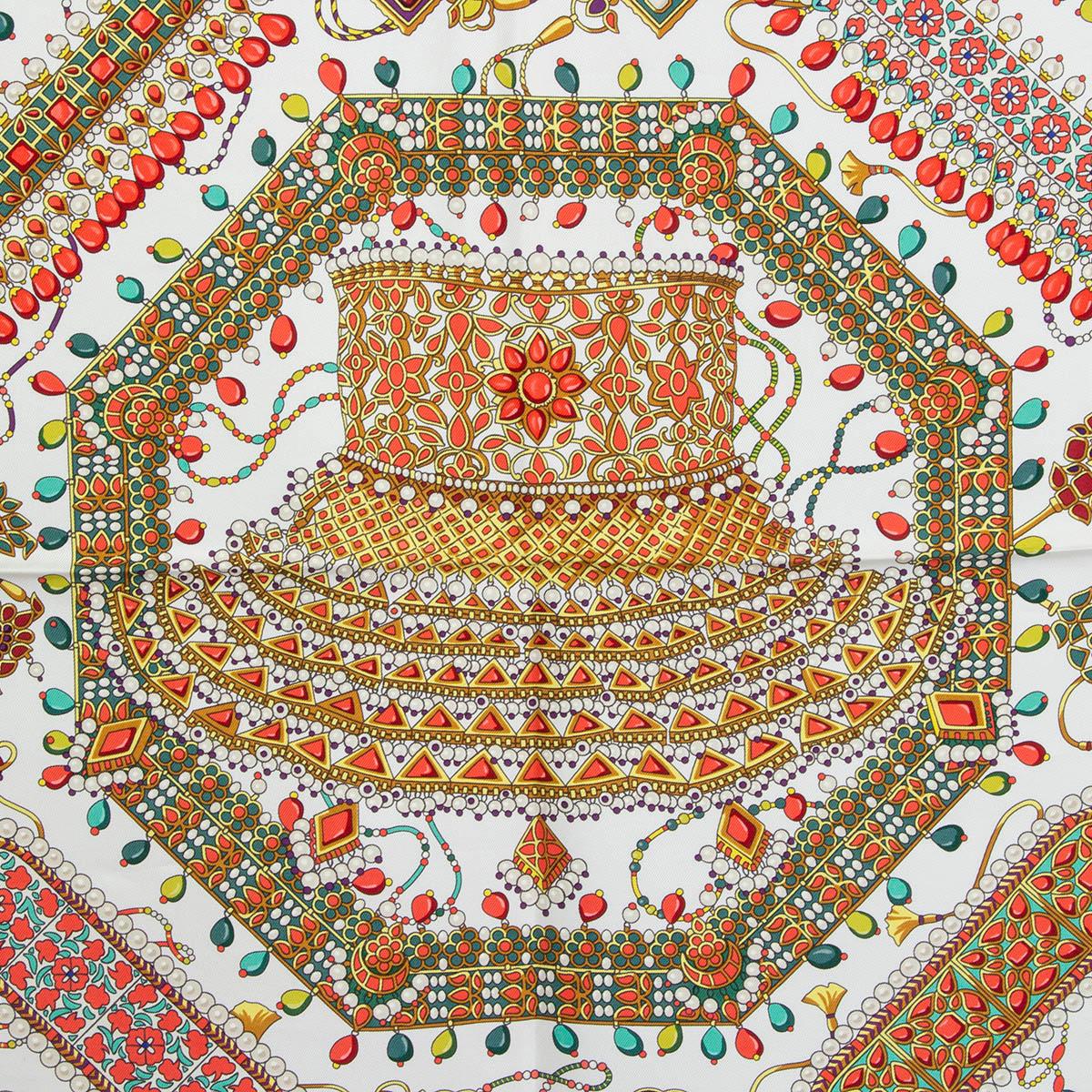 100% authentic Hermes 'Parures des Maharajas 90' scarf by Catherine Baschet in Blanc (white)  silk twill (100%) with contrasting Corail (coral) hem and details in dark and lime green, red, burgundy and purple. Has been worn and is in virtually new