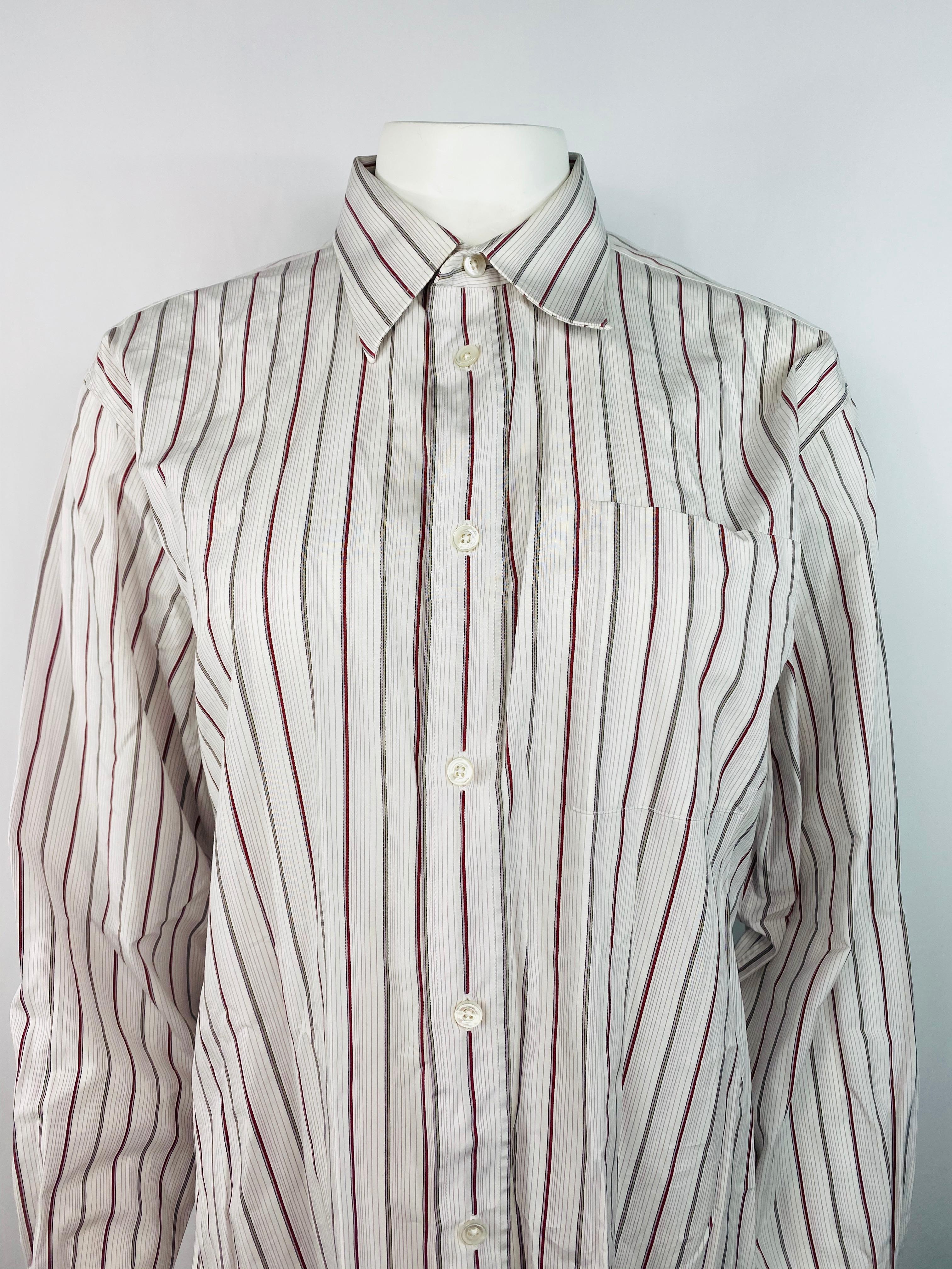 Product details:
Featuring 100% cotton white button down formal shirt with thin green, purple and red striped pattern.
Made in France.