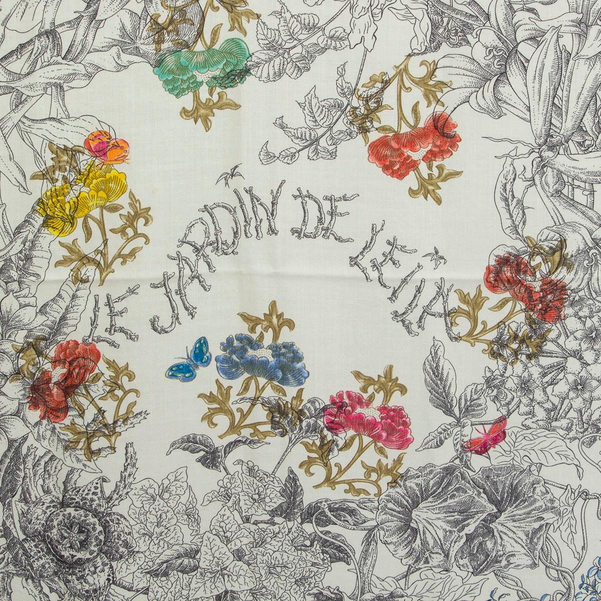 100% authentic Hermès 'Le Jardin de Leila 140' shawl by Francois Houtin in pale orange and off-white cashmere (70%) and silk (30%) with details in anthracite, grey, orange, olive green, yellow, pink, blue and burgundy. Brand new. 

Gardens inhabit