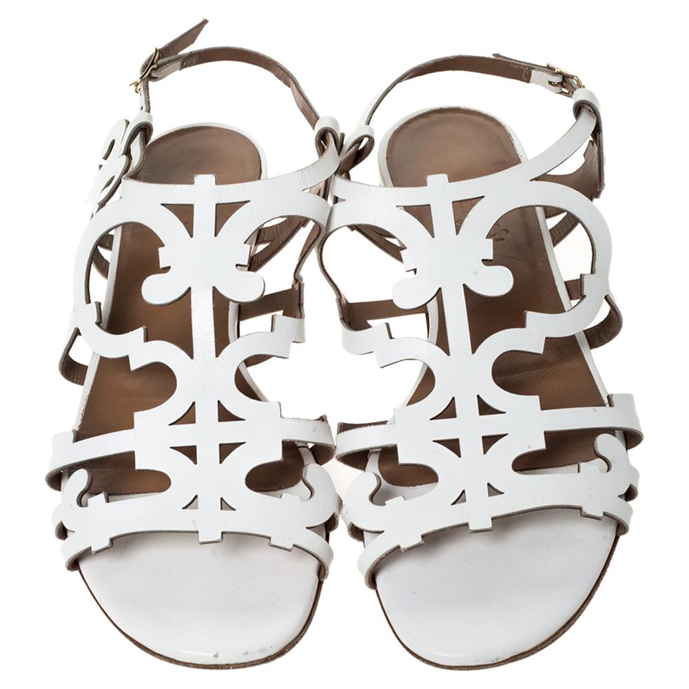 These flats crafted from white leather are characterised by the wonderful cutout design all over. They are meant to frame your feet in a beautiful manner. This pair from the house of Hermes is a fine blend of comfort and easy style.

