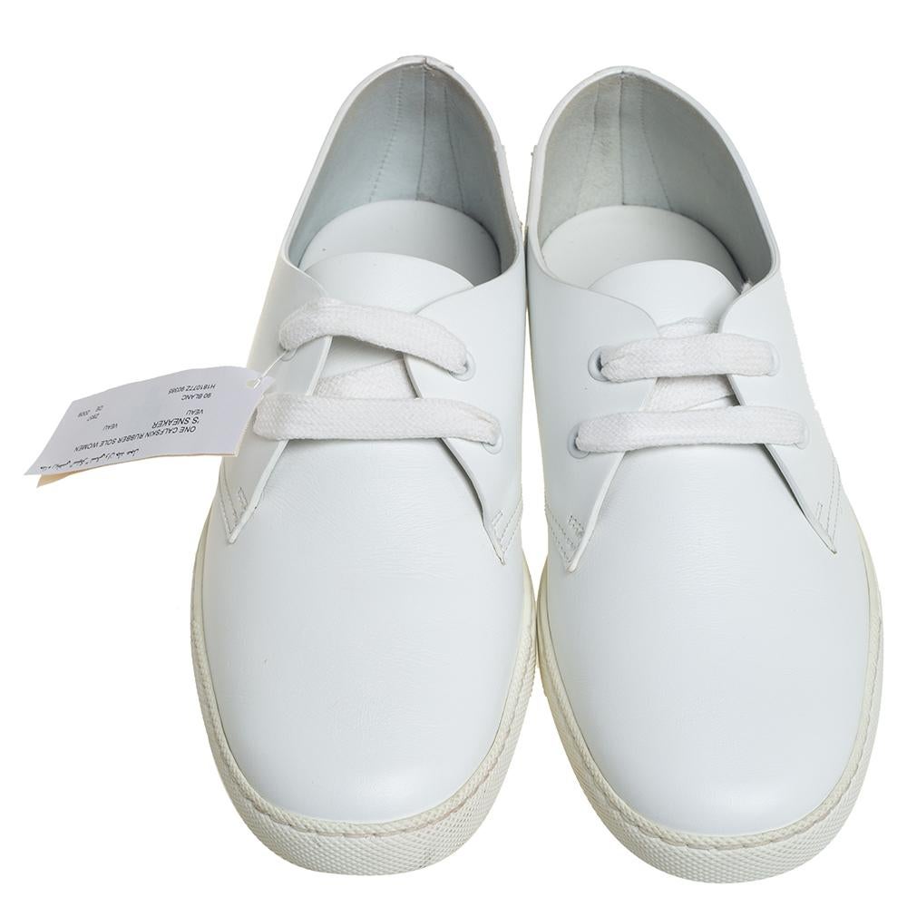 A pair of sneakers by Hermès to take you places in style and comfort. The white sneakers have been crafted from leather and styled with lace-ups and simple round toes. They are complete with the brand detail on the heels.

Includes: Original Box,