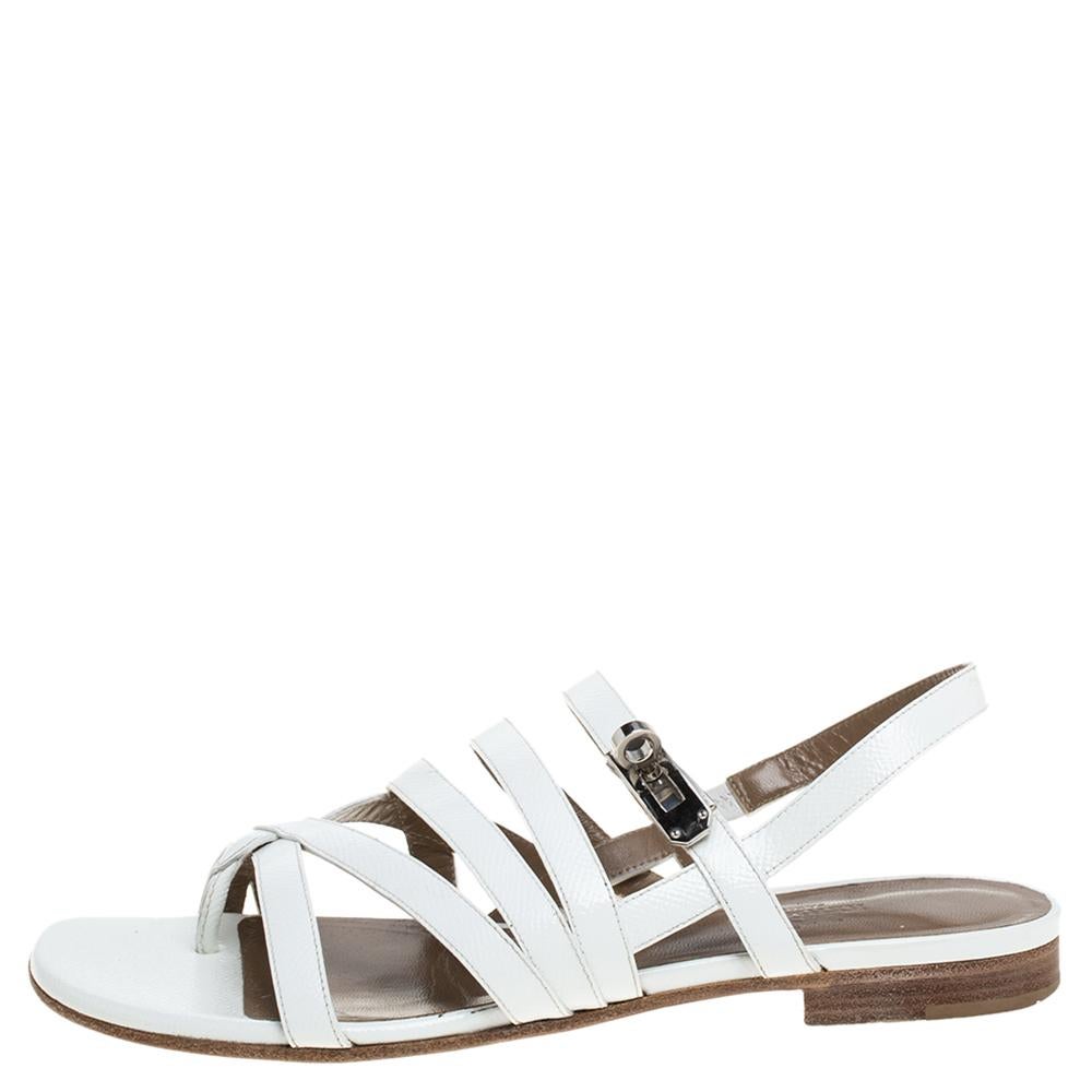 Cut from excellent quality white leather, this pair of strappy flat sandals designed by Hermes is easy to flaunt footwear option. Originated in Itlay, Hermes is known as a leading powerhouse of leather accessories and other high-end products. The
