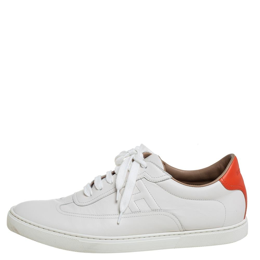 These Quicker sneakers from Hermes promise that you'll shine all day long and fetch compliments from one and all! These white sneakers are crafted from leather and feature round toes, lace-ups on the vamps, and a stitched 'H' detailing on the sides.