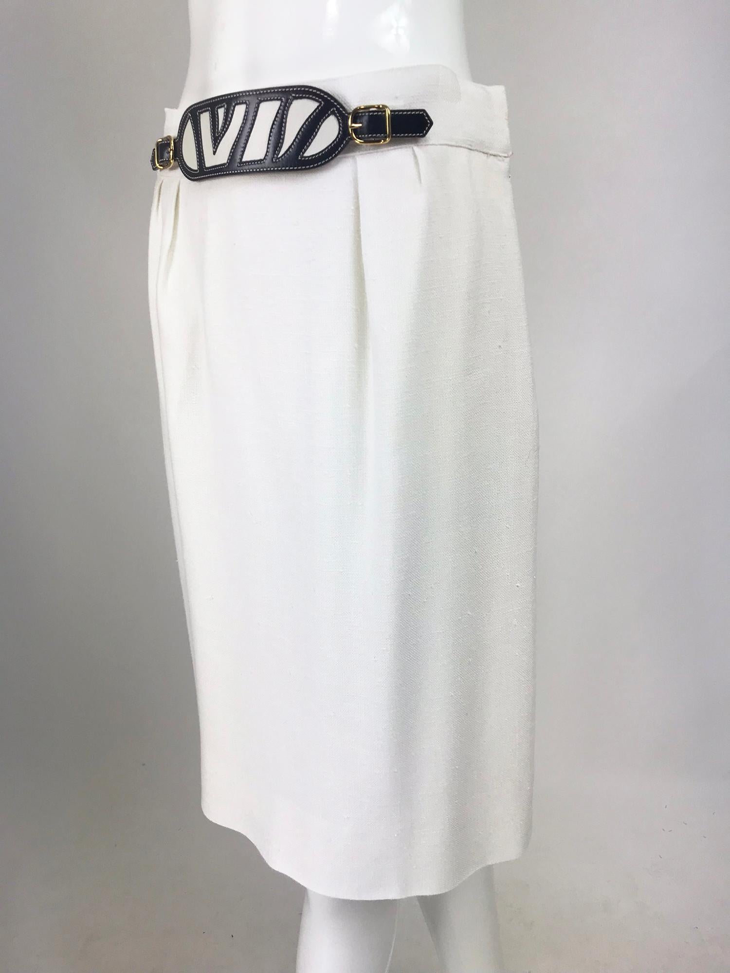 Hermes White linen skirt with navy & white leather belt front from the 1990s. This beautiful skirt has a banded waist the front has a decorative intarsia leather belt in navy blue and white with gold hardware, the belt is marked Hermes see photo,