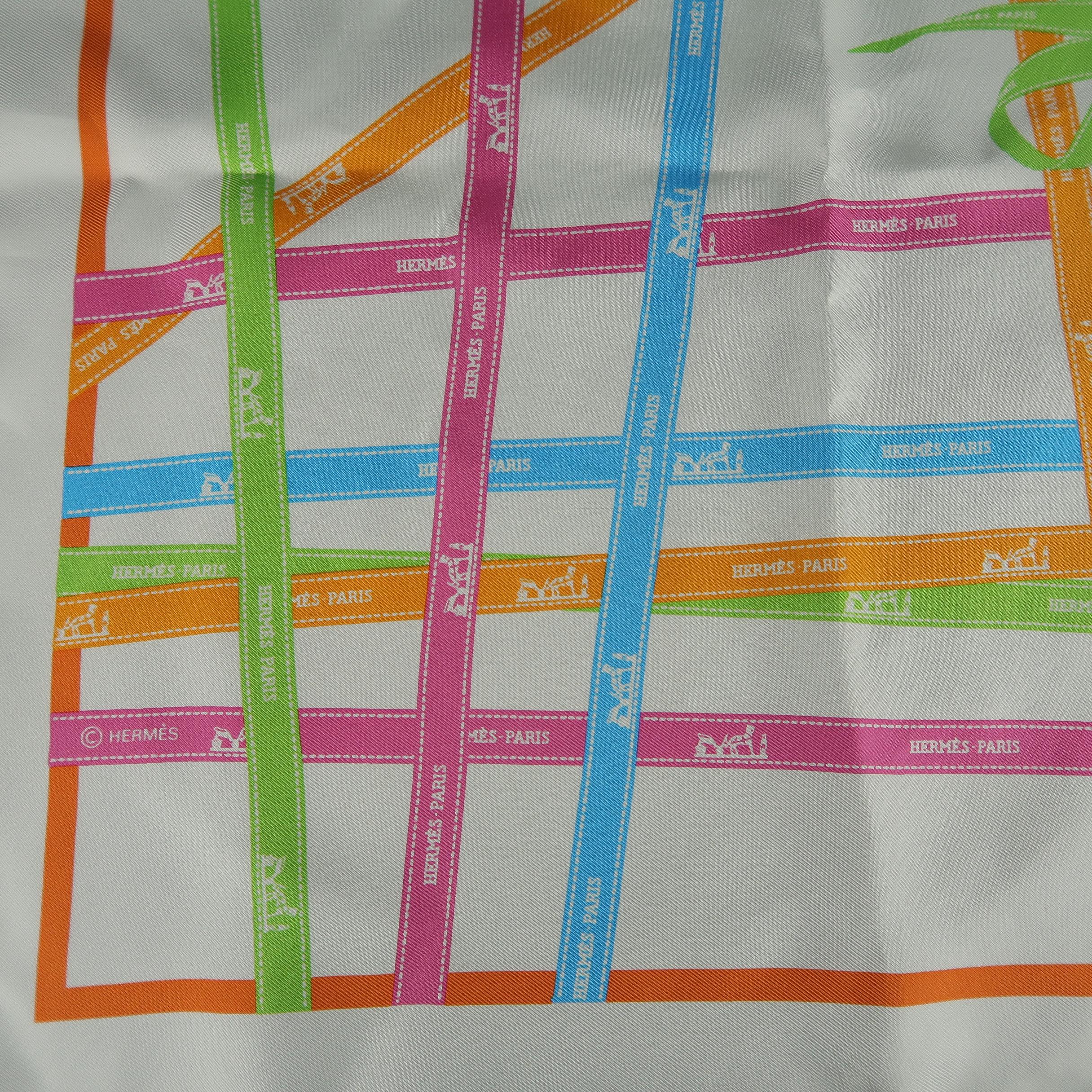 HERMES scarf comes in cream silk with multi-color 