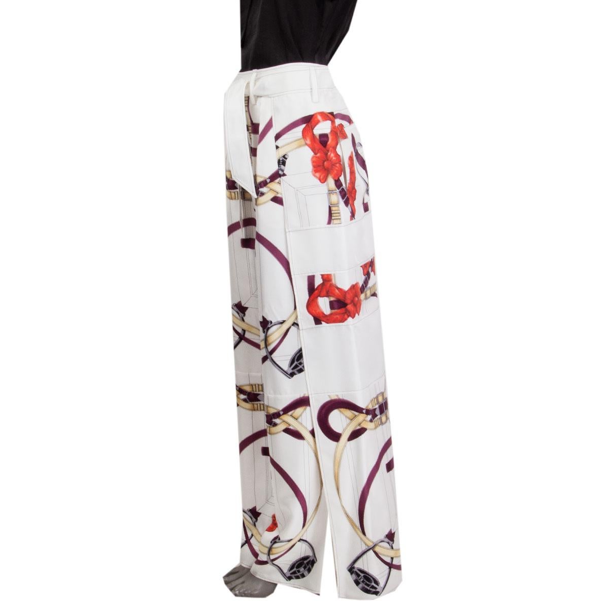 100% authentic Hermes layered palazzo pants in white silk (100%) with multicolored print. Closes with one button on both waist-line sides and with a silk belt. Lined in white silk (100%), has slit pockets on the side and patch pockets on the back.