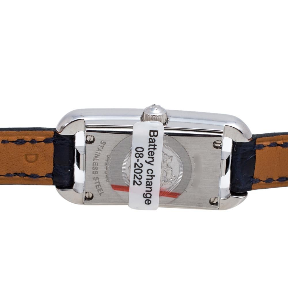 This Nantucket watch from Hermes stands for quality and sophistication. The watch features a stainless steel case held by leather straps that are secured with a pin buckle. Powered by a quartz movement, this elegant timepiece has an anchor
