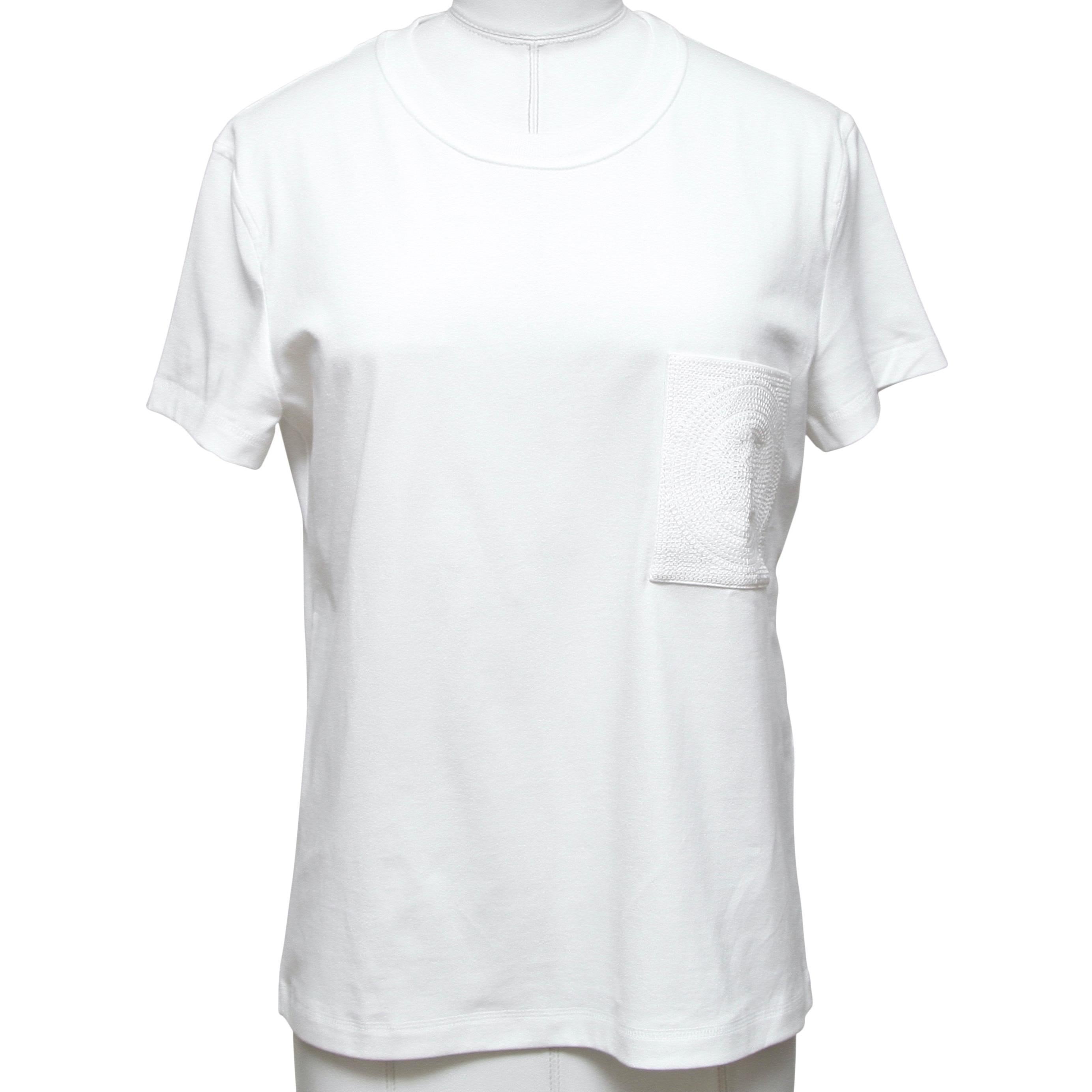 GUARANTEED AUTHENTIC HERMES MOSAIQUE EMBROIDERY WHITE T SHIRT

Design:
- White mosaique embroidery pocket against a white color.
- Crew neck.
- Short sleeve.
- Slip on.

Size: 36

Material: 100% Cotton

Measurements (Approximate laid flat):
-