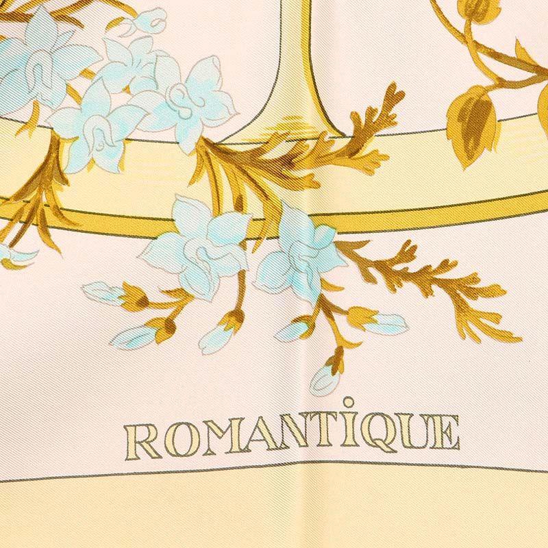 Hermes 'Romantique 90' scarf designed by Maurice Tranchant in soft yellow border and white background with details in peach, pale blue, and antique gold silk twill (100%). Has been worn and is in excellent condition.

Width 90cm (35.1in)
Height 90cm