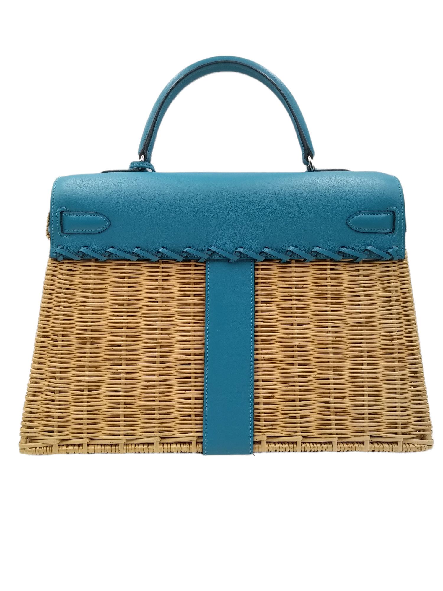 Hermès Wicker and Turquoise Barenia Leather Picnic Bag Kelly 35cm Palladium Hardware, 2013
- 100% authentic Hermès
- Osier wicker with a front flap of barenia leather
- two straps with front toggle closure,clochette with lock and two keys
- single