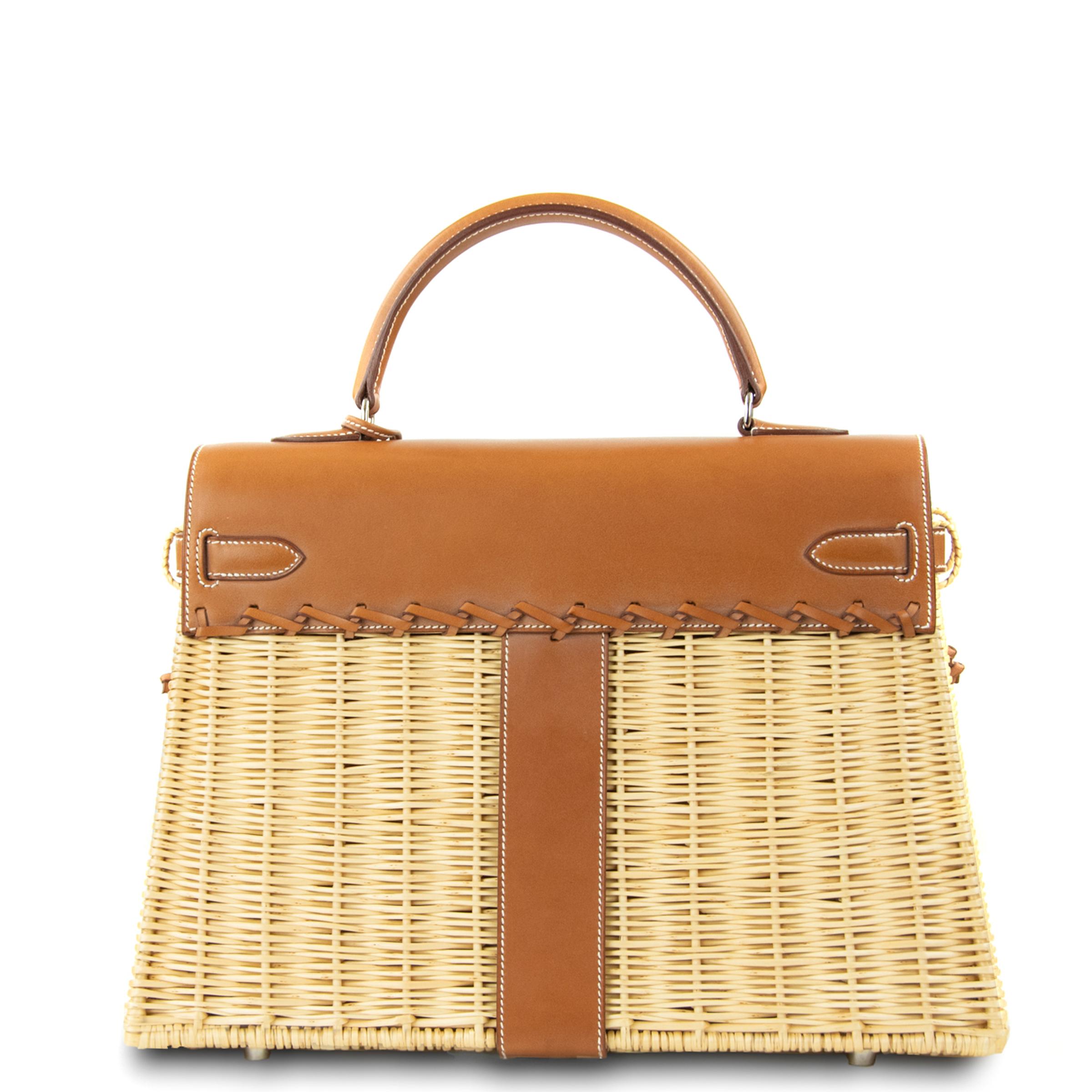 This limited edition Hermes Kelly bag is a truly rare collectors item.  Stunning woven wicker basket with Hermes Barenia leather.  Features palladium hardware.  Kelly detachable strap is made of barenia leather and embellished with incredible