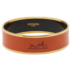 Hermes Wide Orange Enamel Gold Tone Metal Bangle Bracelet