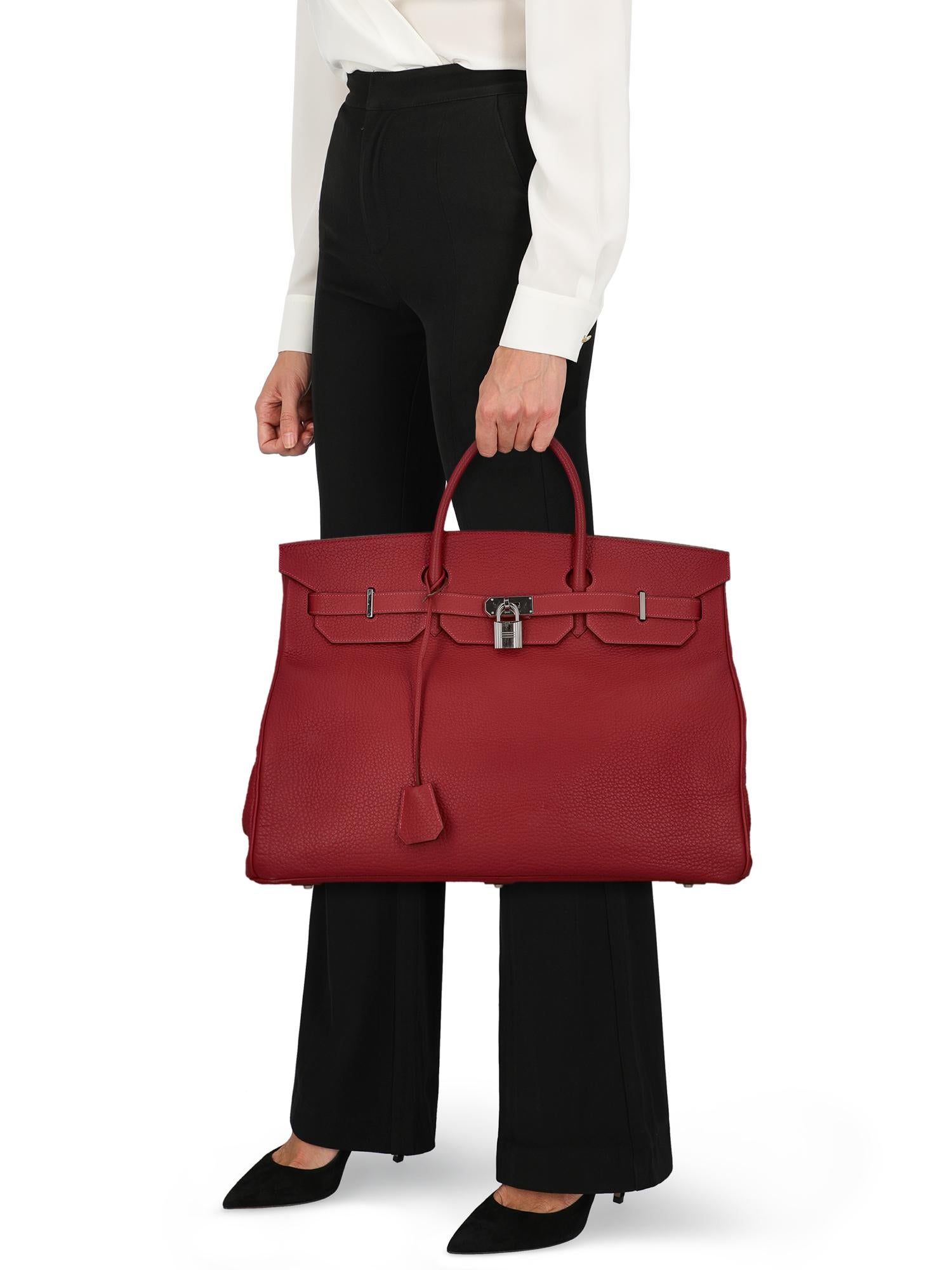 Product Description: Birkin voyage, rouge garance, veau togo, leather, solid color, printed logo, turn-lock closure, silver-tone hardware, internal zipped pocket, day bag

Includes: 
- Lock
- Key
- Clochette
- Dust bag

Product Condition: Very