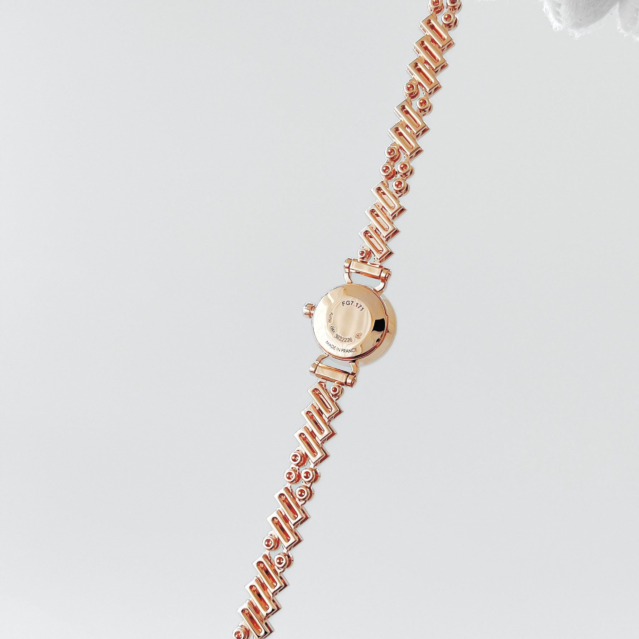 Shop this elegant Hermès Women's Faubourg Polka Watch in Rose Gold And Diamonds. This pretty watch comes in the mini model with a 15mm watch face. Coming in 18ct rose gold with 33 white diamonds (0.2 ct), which are set into a mother-of-pearl dial.