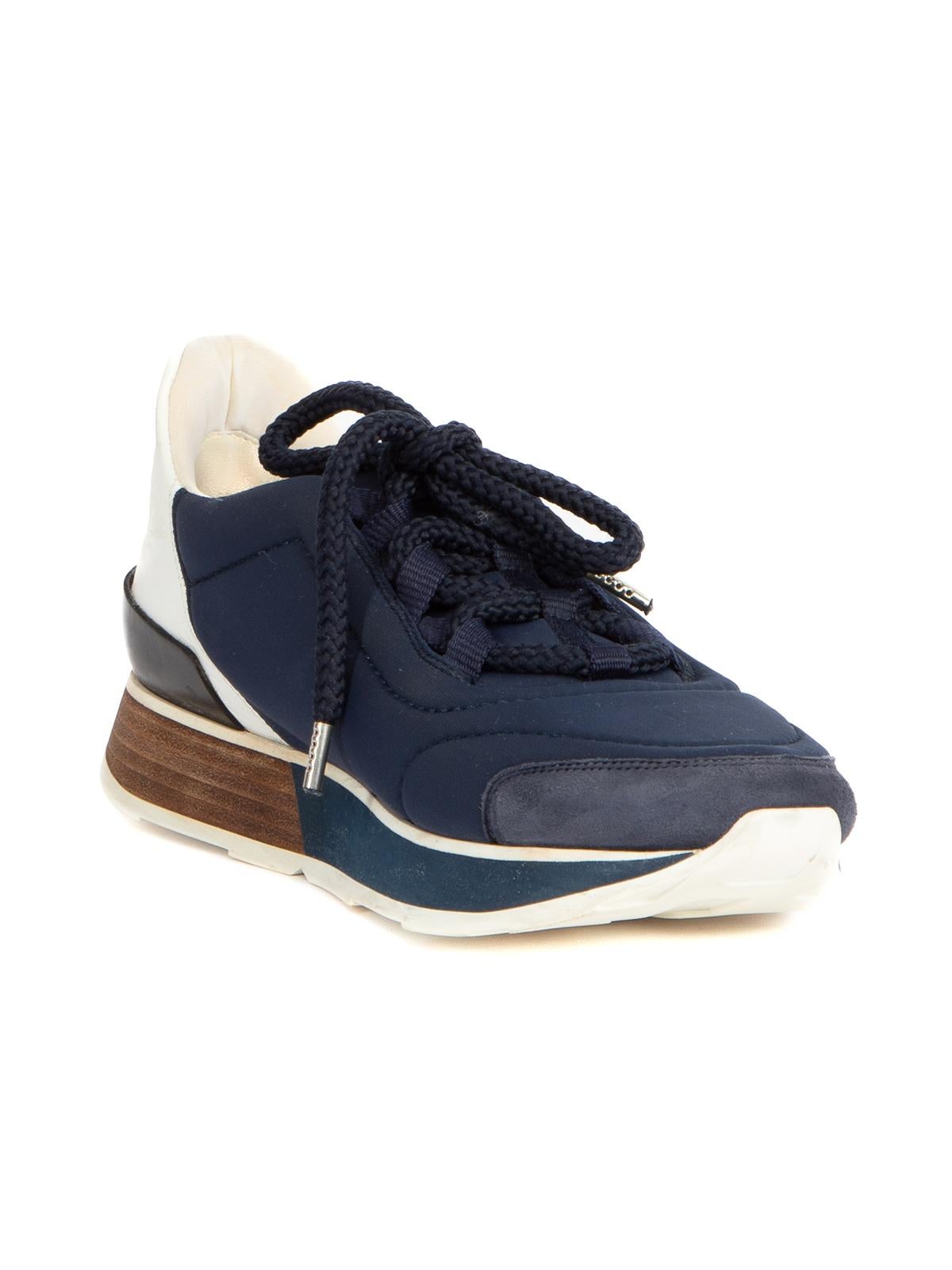 CONDITION is Very good. Minimal wear to sneakers is evident. Minimal wear suede around the toe of shoe on this used Hermes designer resale item.   Details  Navy with white, black and brown Cloth- nylon Low top Lace up Suede toe point Almond toe   