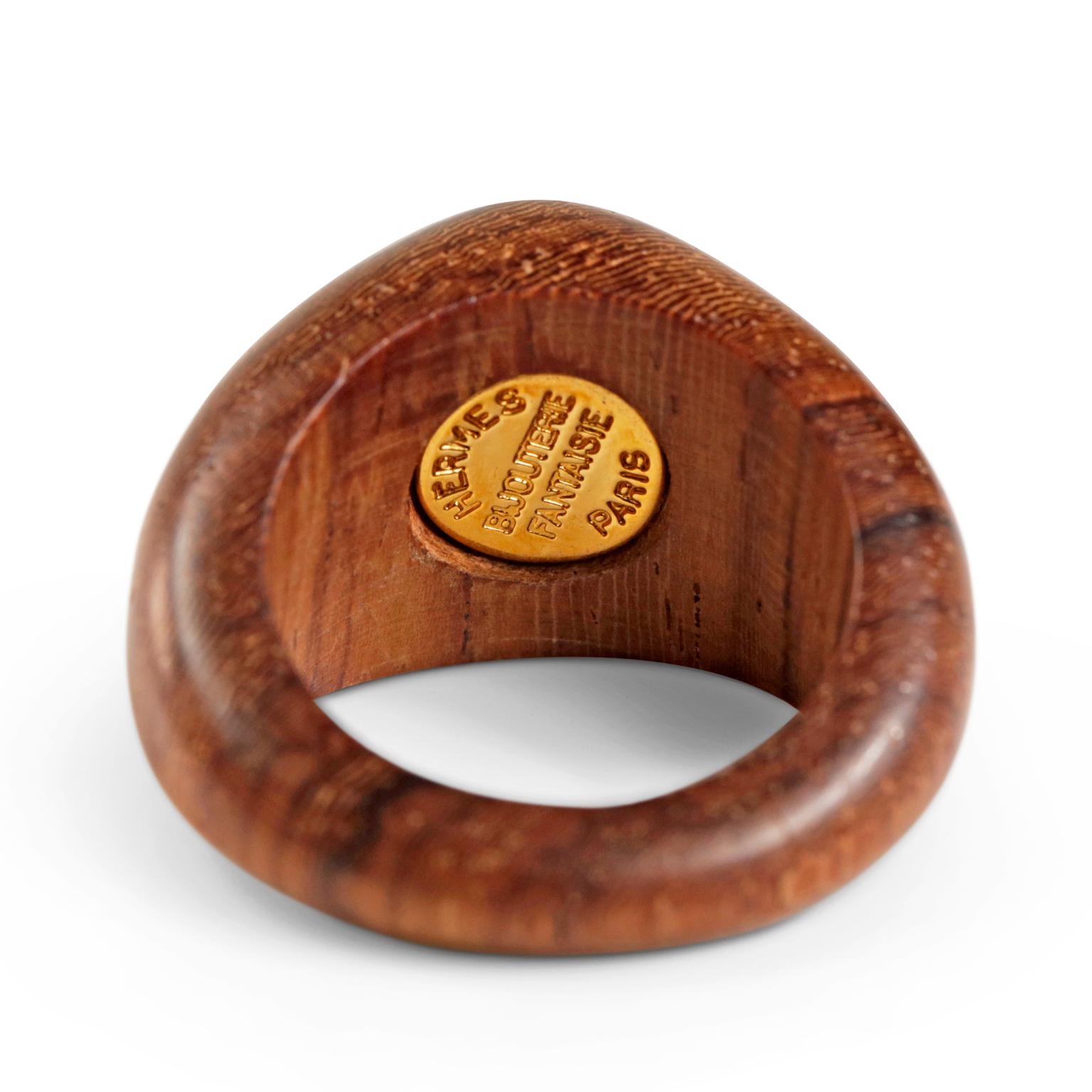 Hermès Wood and Gold Ring- Mint Condition
 18 karat stamped signet on wood ring.  Size 5.  Made in France.
