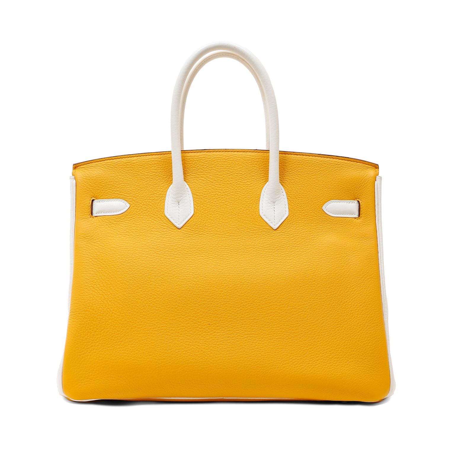 This authentic Hermès Yellow and White Clemence 35 cm Birkin is in excellent condition.  Hermès bags are handstitched and usually require extensive wait lists.   This uniquely bicolored Birkin is very collectible. 
Sunny yellow Clemence leather is