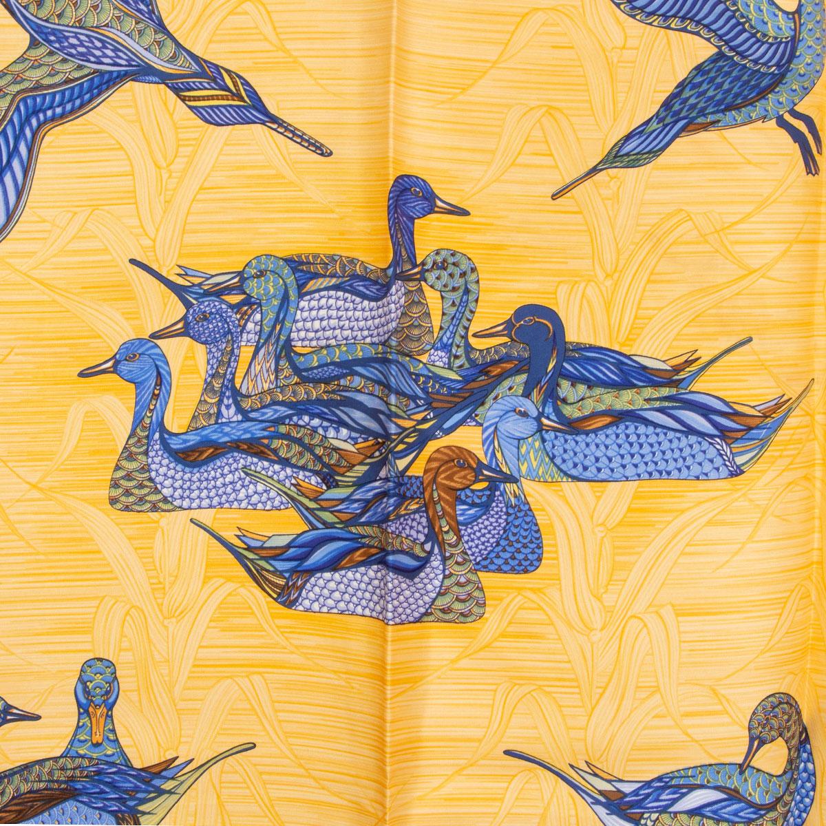 100% authentic Hermes 'La Mare aux Canards 90' scarf by Daphne Duchesne in orange silk twill (100%) with details in gblue, navy and green. Has been worn and is in excellent condition.

Width	90cm (35.1in)
Height	90cm (35.1in)

All our listings