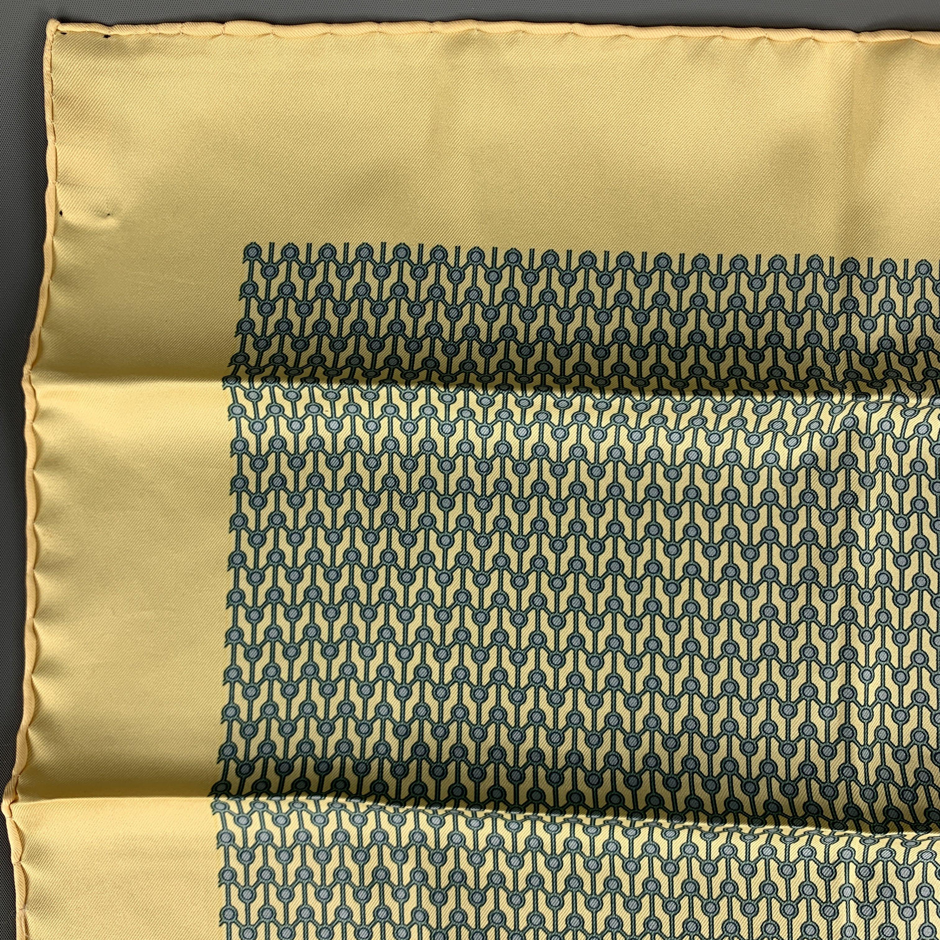 Vintage HERMES Pocket Square comes in a yellow and blue silk, with all over abstract geometric print. Made in France.
 
Excellent Pre-Owned Condition.
 
16.5 x 16.5 in.