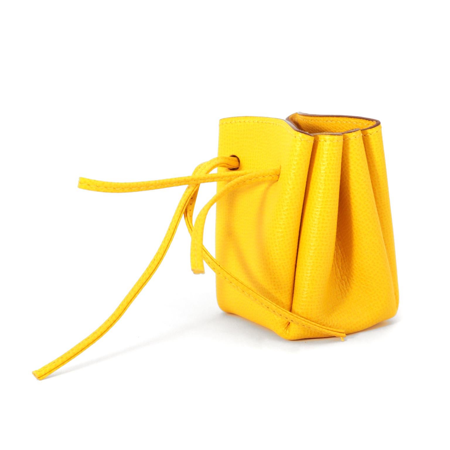 This authentic Hermès Yellow Epsom Vespa Pouch is in pristine condition.  Adorably dangles from a bag or tossed inside, this cheerful little accessory is a great gift.  Made in France.

Measurements:  3.5” x 3.75” x 2.25”  

PBF
