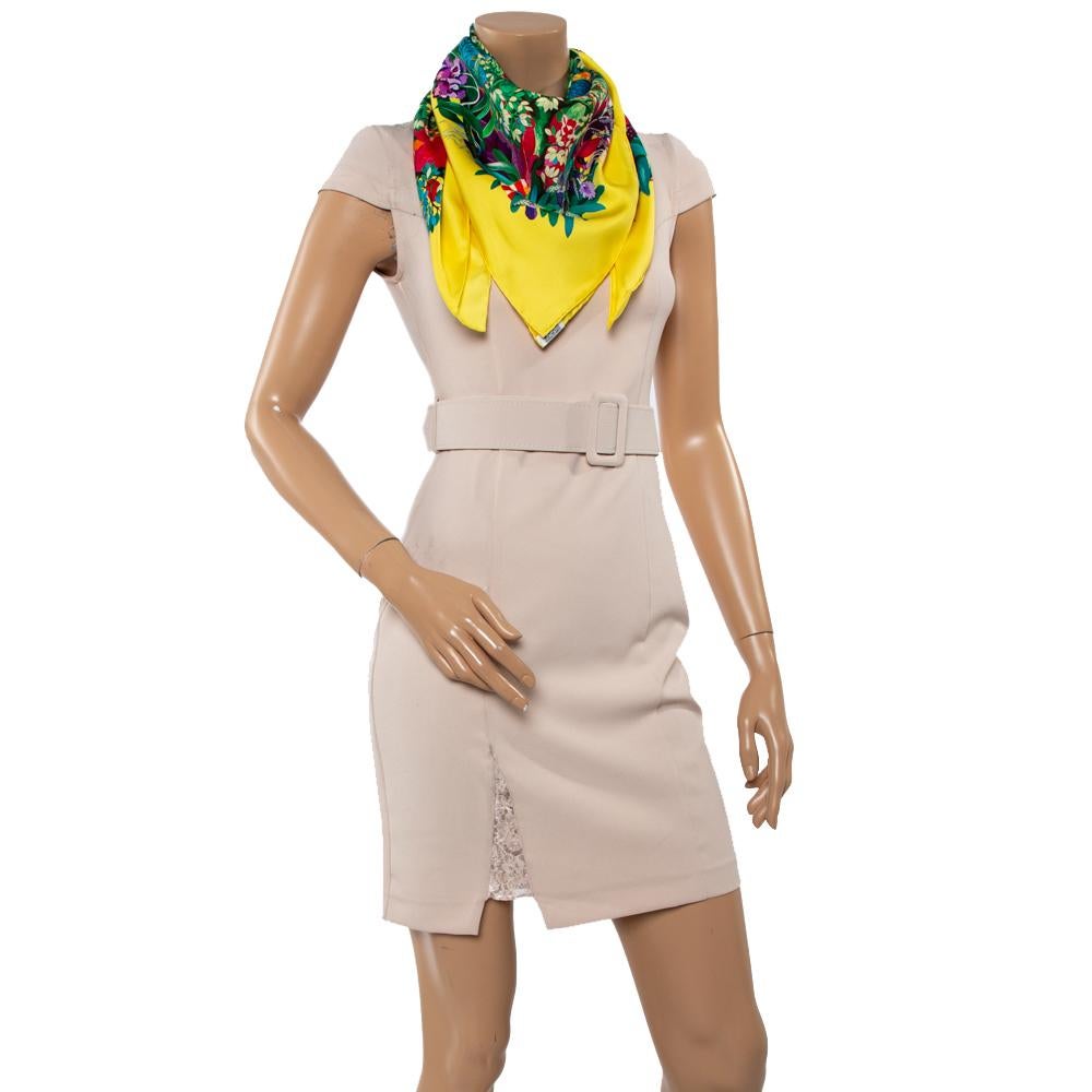 From the house of Hermès, this beautiful scarf is a perfect addition to your precious collection of accessories. Crafted from silk, it is accented with a vibrant tropical forest print with plush flora and fauna, which is called Heart of Life. The
