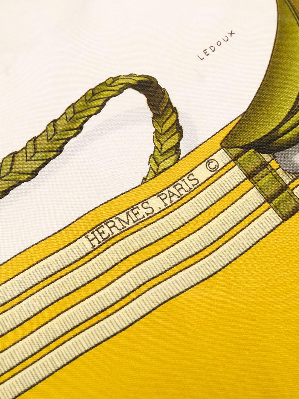 Hermes silk scarf Jumping by Philippe Ledoux featuring a yellow border, a horse scene.
In excellent vintage condition. Made in France.
35,4in. (90cm)  X 35,4in. (90cm)
We guarantee you will receive this  iconic item as described and showed on