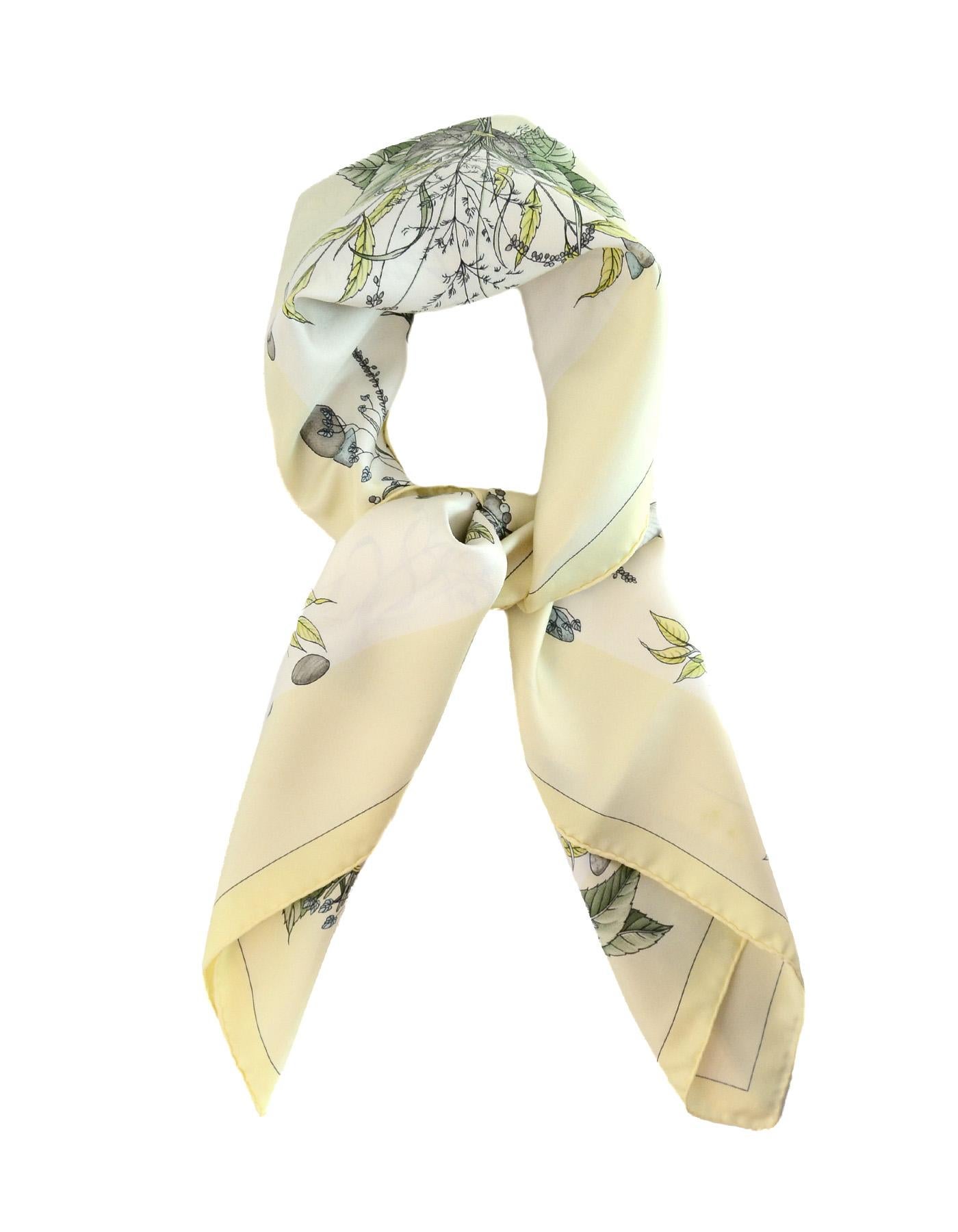 Hermes Yellow Pythagore Floral Printed Silk Scarf 90cm

Made In:  France
Color: Yellow, green, blue print
Materials: 100% silk
Overall Condition: Very good pre-owned condition with exception of light staining

Measurements: 
35