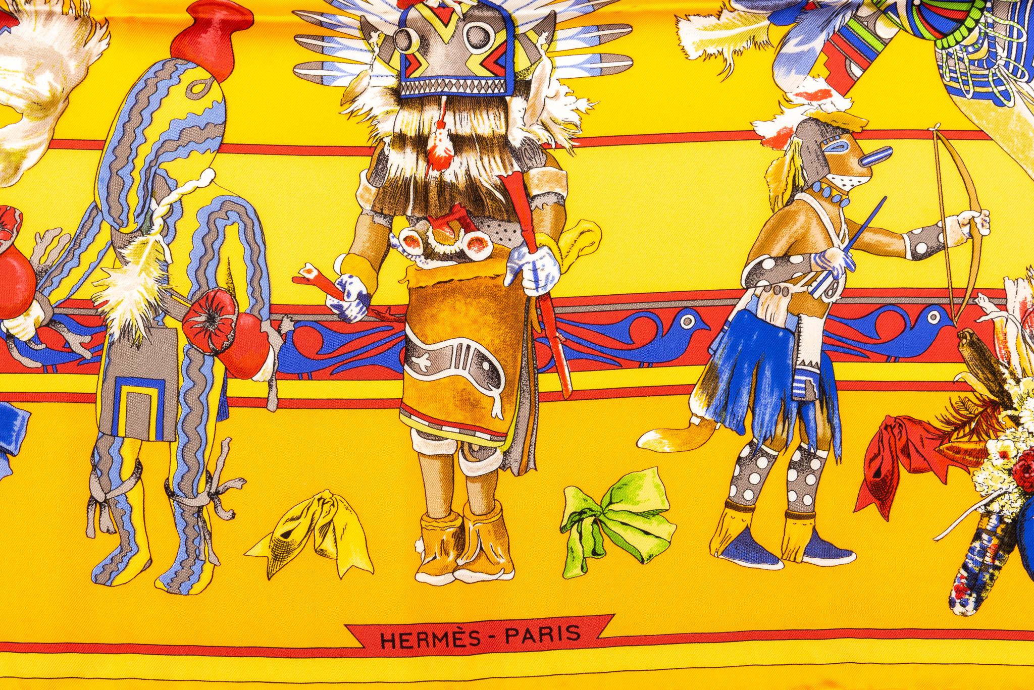 Hermès collectible yellow silk twill Kachinas scarf designed by Kermit Oliver. Hand-rolled edges.  Excellent condition. No box, with composition and care label.