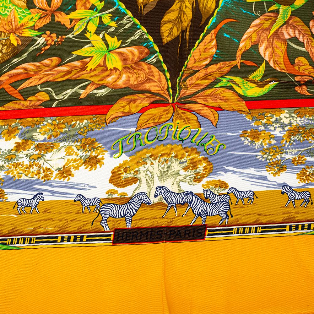Lovely to look at, this scarf from Hermes will compliment any outfit you wear. The yellow scarf is made of silk and features a beautiful print all over.

