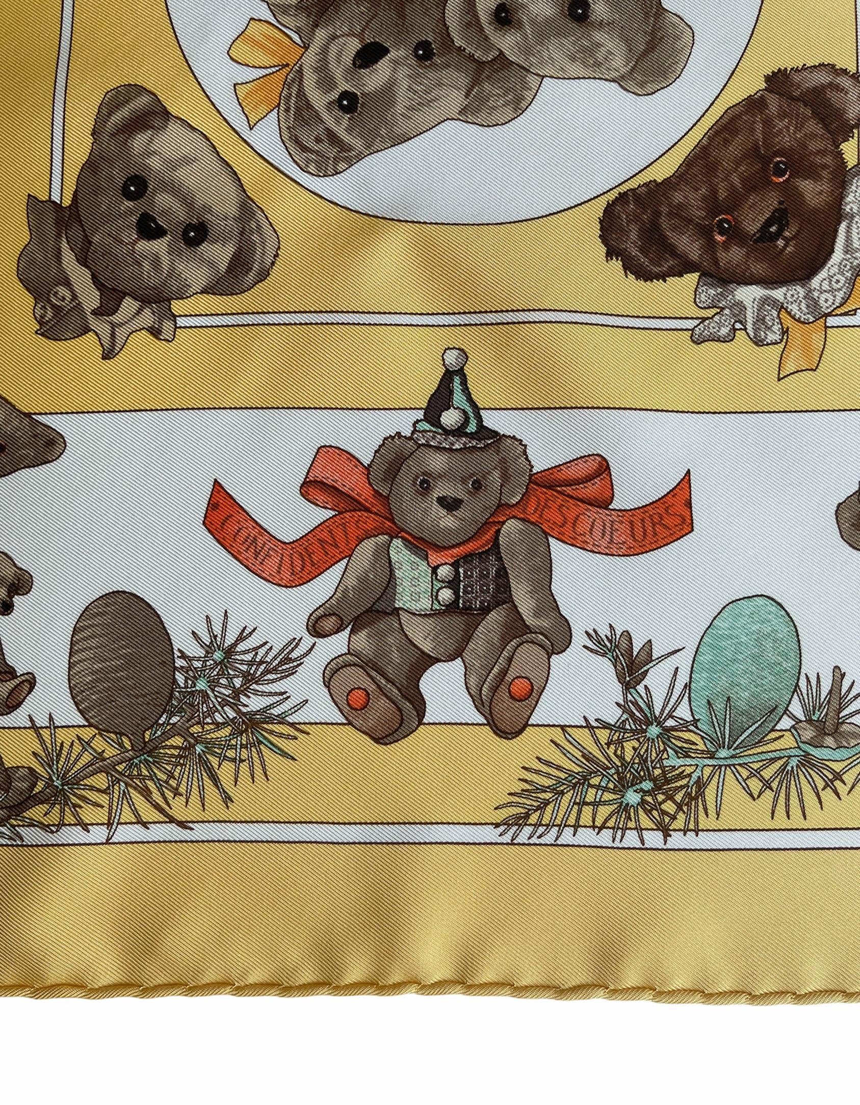 Hermes Yellow/White Silk Confidents Des Coeurs 45cm Pocket Square By Loic Dubigeon.  Features teddy bear print.
Made In: France
Color: Yellow, white, brown
Materials: 100% silk
Overall Condition: Excellent pre-owned

Measurements: 45cm
17