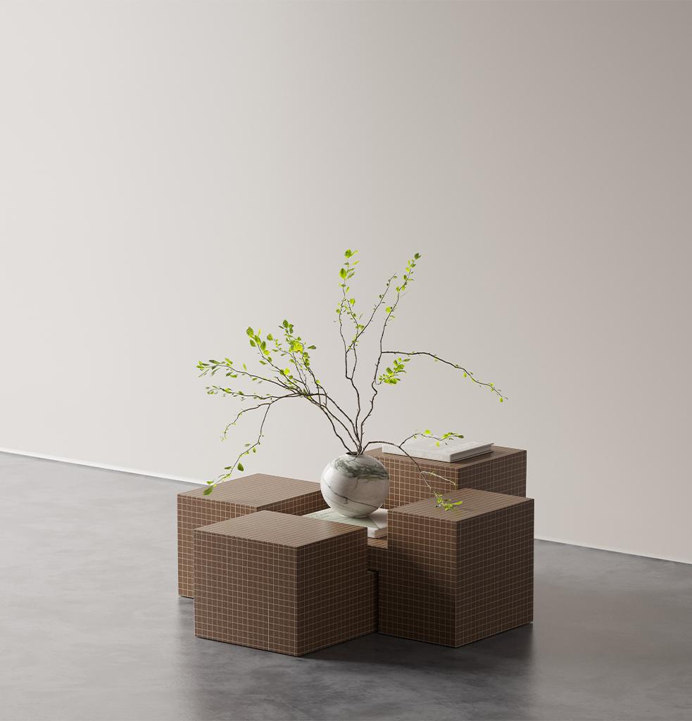 Formada por la composición de cubos geométricos, la mesa Qub introduce ritmo y movimiento en cualquier espacio. Su estructura modular de dos piezas ofrece flexibilidad en la disposición, adaptándose fácilmente a distintas distribuciones y escenarios