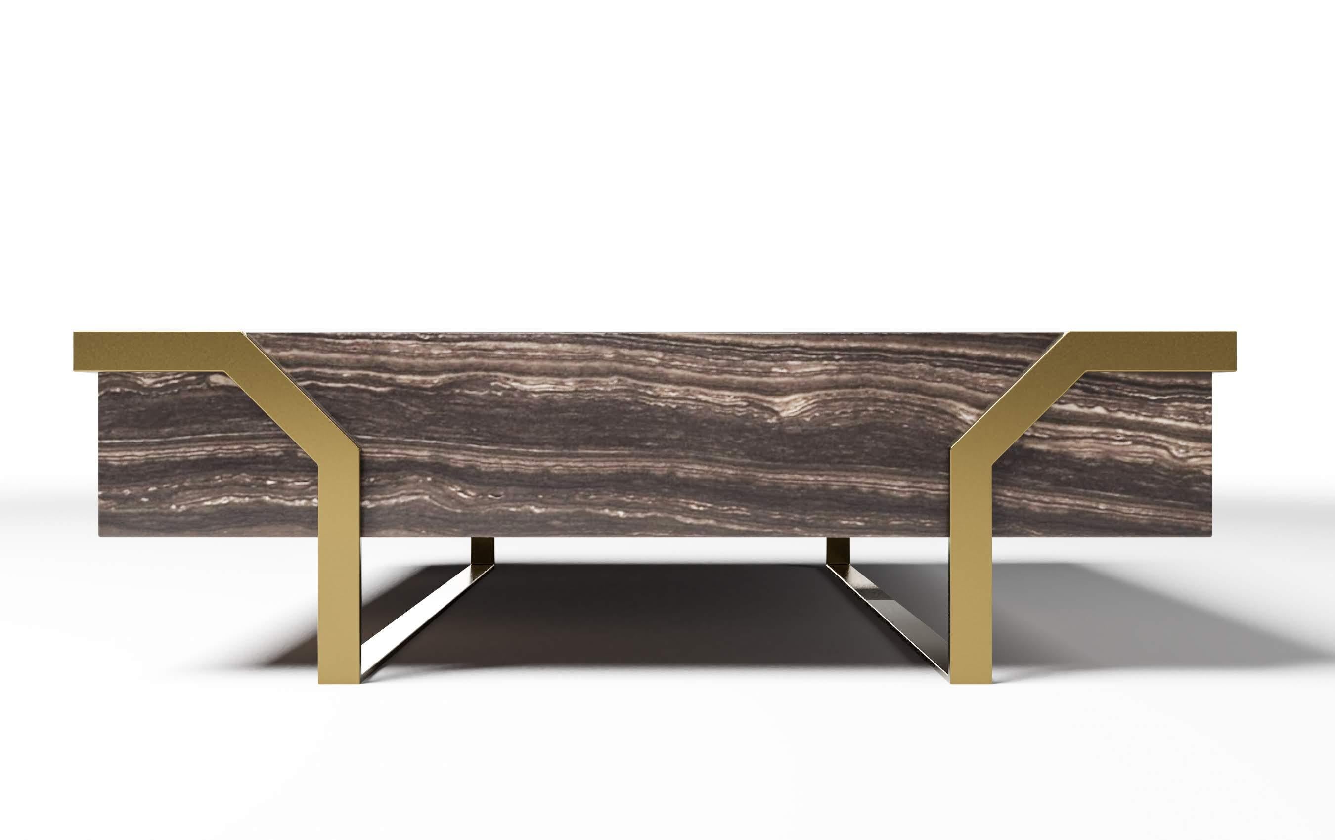 The Hermosa coffee table is of generous size with unique symmetrical metallic legs. It is offered in a variety of woods, marbles and lacquered tops. It is part of Susan Hornbeak's Ortiz Milano brand and is handcrafted in Italy with precision and
