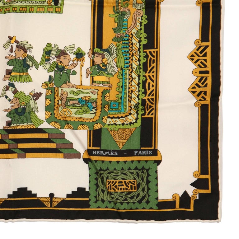  Hermès Astres et Soleils 90 cm Silk Scarf - PRISTINE
 Designed by Annie Faivre.  White background with jungle green and gold accents.  Depiction of ancient Mayan peoples and temples.  100% silk.  Made in France.
A362