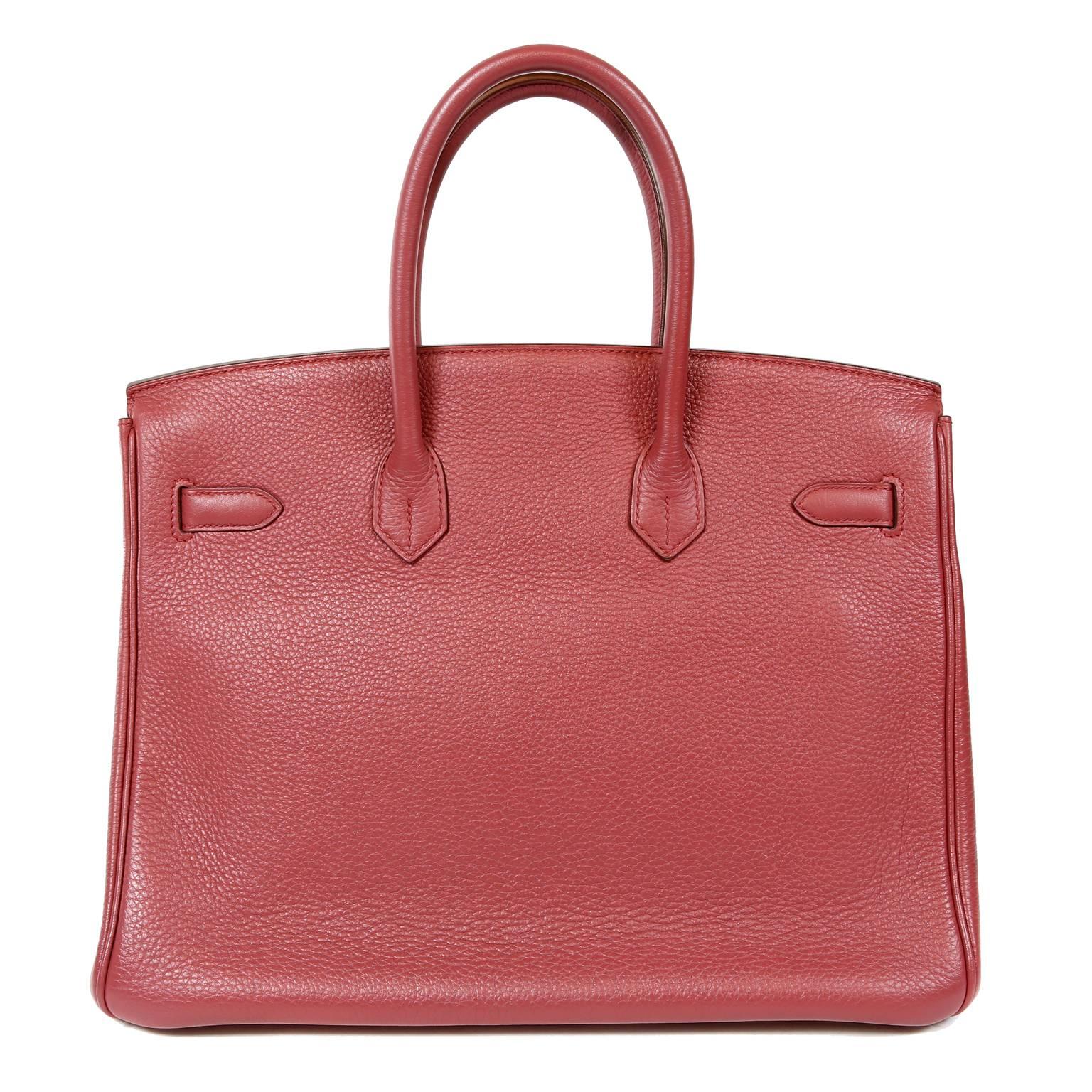 Hermès Bois de Rose Togo Leather 35 cm Birkin-  excellent  condition with the protective plastic intact on the hardware. 
Hand created, Hermès bags are highly sought after and can be nearly impossible to get.  Bois de Rose is a subdued shade of