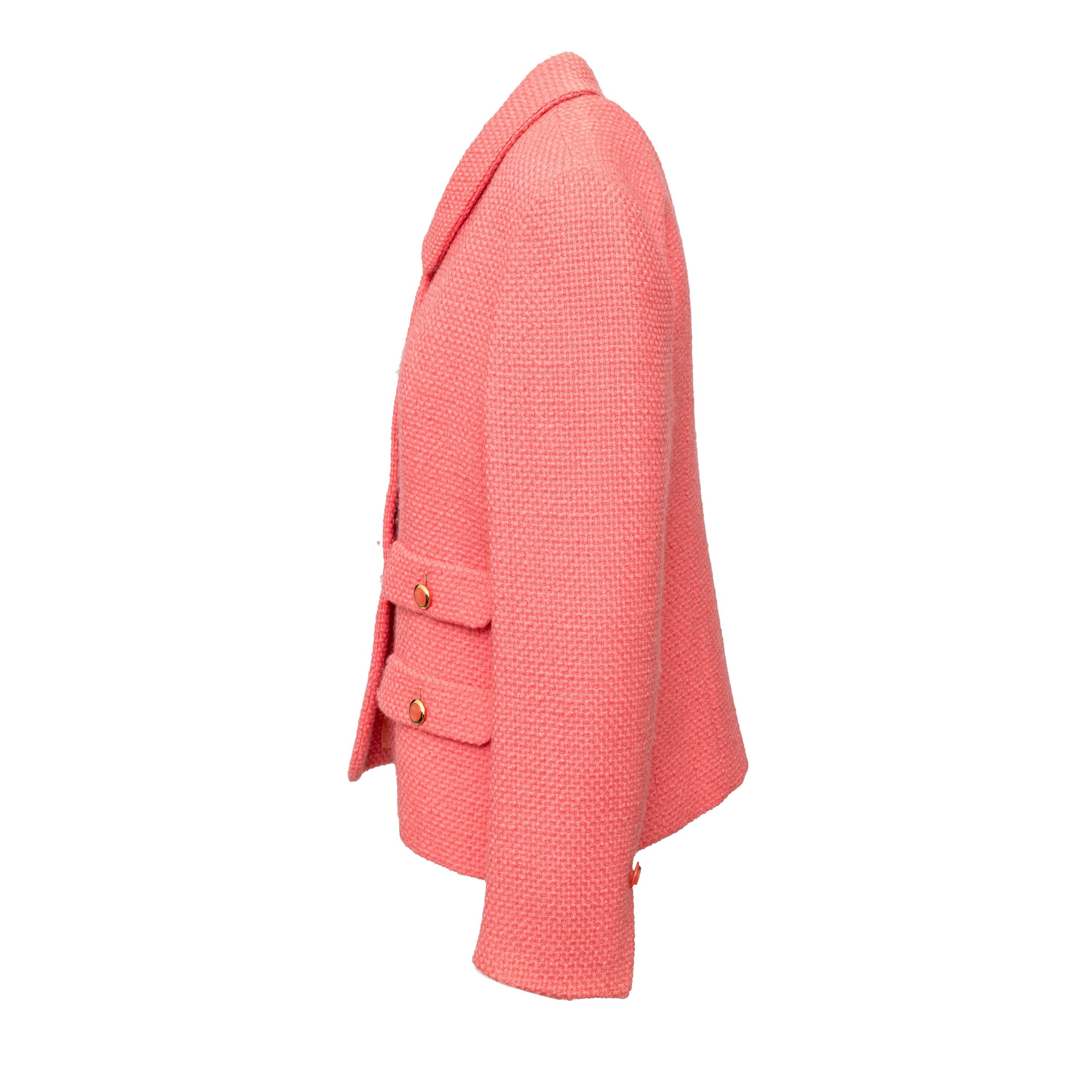 Add a pop of color to your wardrobe with this 90s piece by Herno. This salmon pink jacket is made of a textured wool blend and features a round collar with front button closure. With 4 flap pockets and a pleated design for a feminine fit.
 Remarks: