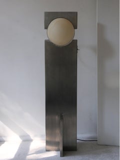 Lampe Hero Lampe sculpturale en acier inoxydable, sphère en pierre
