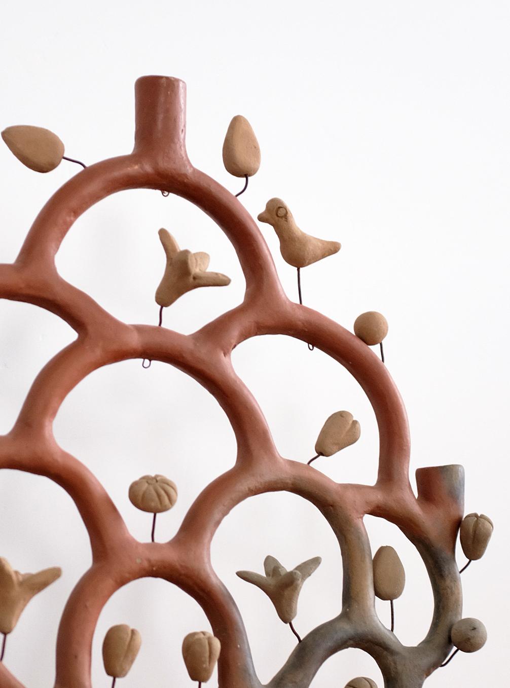 Heron Martinez Mendoza terracotta Tree-of-Life candelabra with folk art animal and floral details. Heron Martinez Mendoza was one of Mexico's masters of folk art ceramics and his pieces are very whimsical and pleasing. 

The candelabra is made of