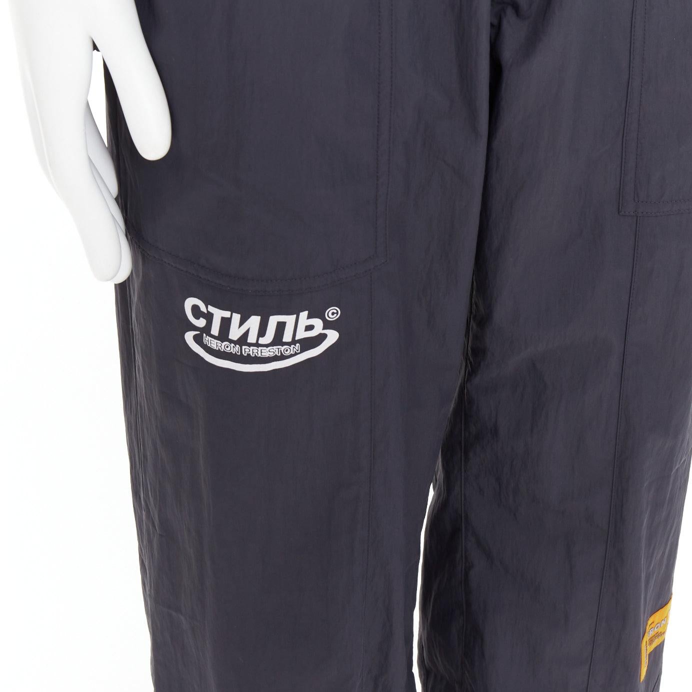 HERON PRESTON black orange nylon patchwork logo drawstring joggers M
Reference: BNAY/A00025
Brand: Heron Preston
Material: Nylon
Color: Black, Orange
Pattern: Solid
Closure: Drawstring
Extra Details: Translated as ‚Äòstyle‚Äô in Russian, Heron