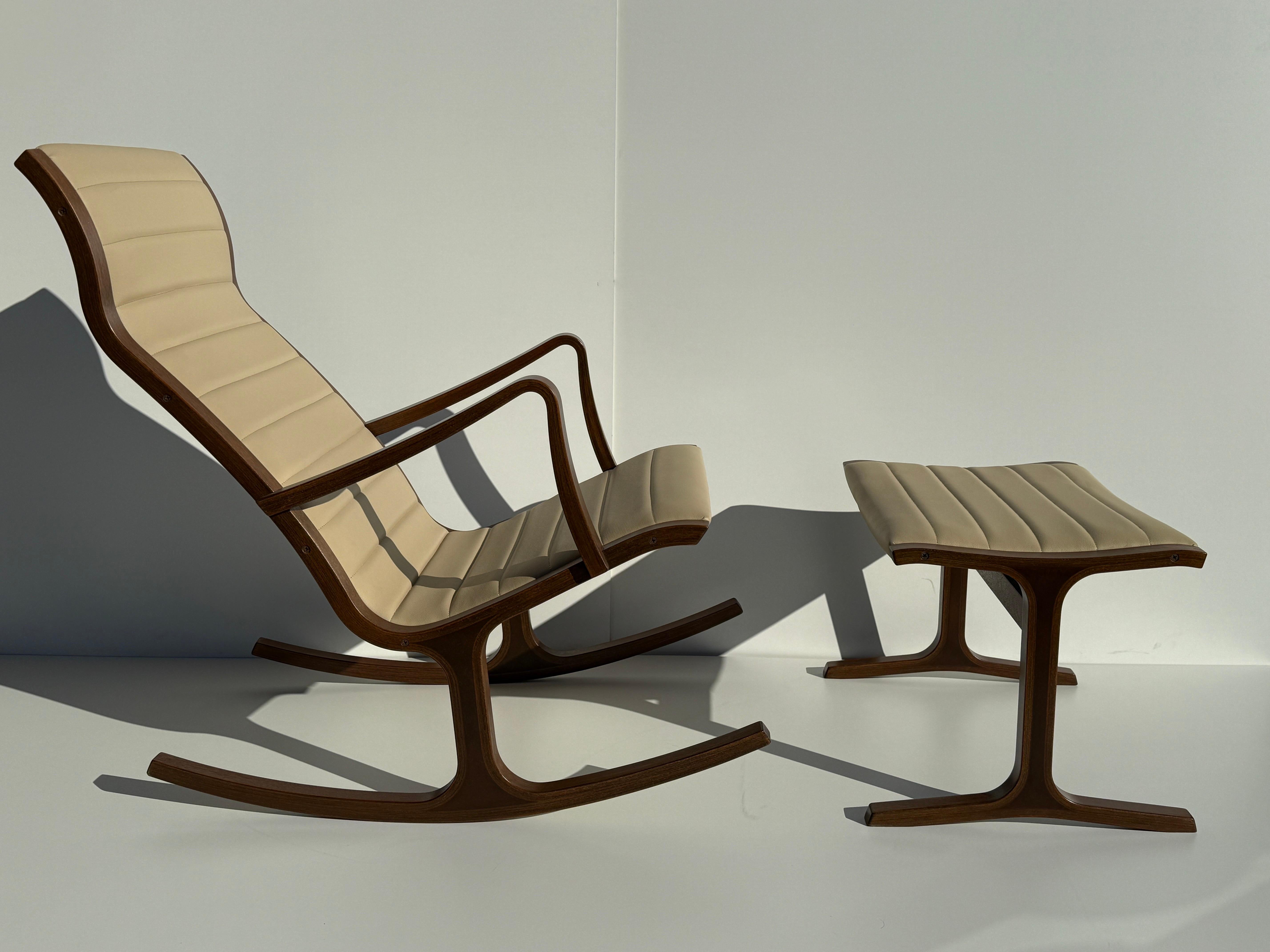 Heron rocking chair and matching footrest / ottoman designed by Mitsunasa Sugasawa and made of bent laminated oak. Manufactured by Tendo Mokko Japan. Chair has been professionally refinished and upholstered in soft cream color vinyl. True example of