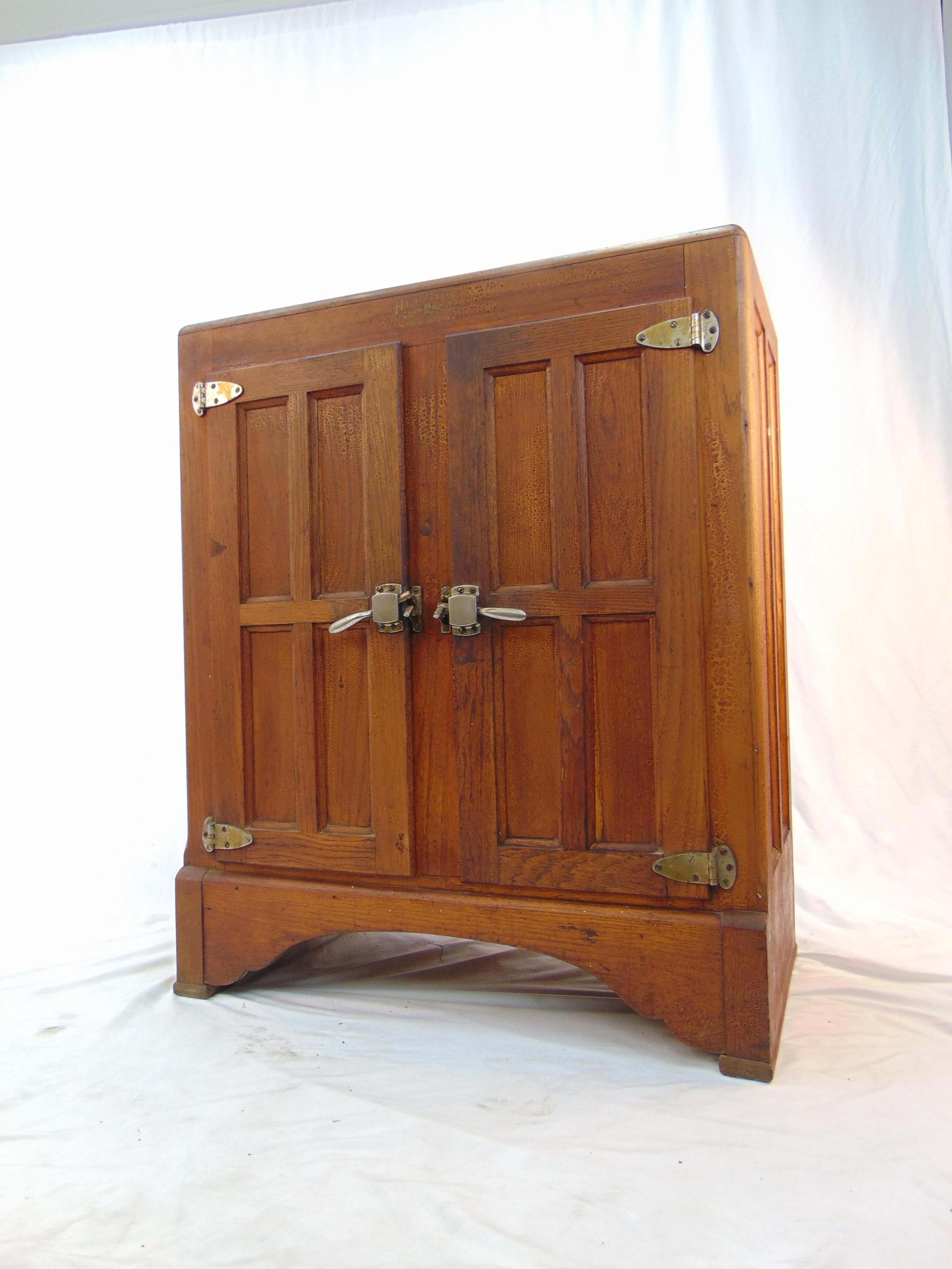 Wonderful vintage wood refrigerator by Herrick's. The wood has a lot of character and patina. 
The dimensions are:
 18'' x 34'' x 41'' H.
 