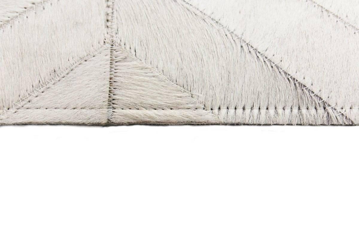 This modern neutral rug is great for offices, bedrooms, dining rooms. The primary color is cream/off white, pattern is Chevron.
Construction handmade
Technique flat-weave
Material cowhide
Gender neutral
Floor heating safe no.

Rug size: 8' x