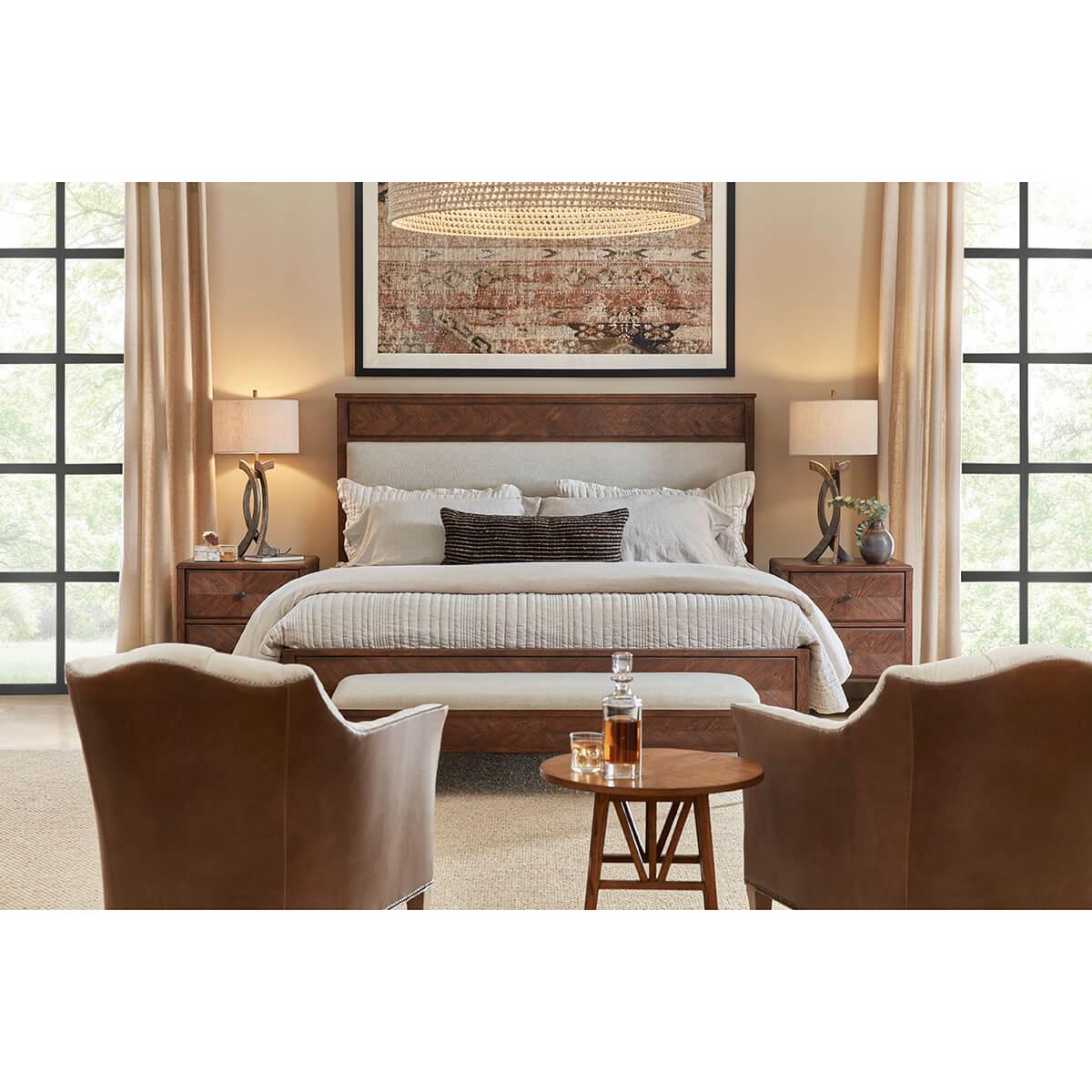 Crafted from rustic oak. This beautiful bed has a hand-carved starburst design. It has a classic silhouette with an upholstered panel headboard with a framed oak side rail and tapered finish leg. 
Shown in Dusk Finish
Shown in Linen-UP5409